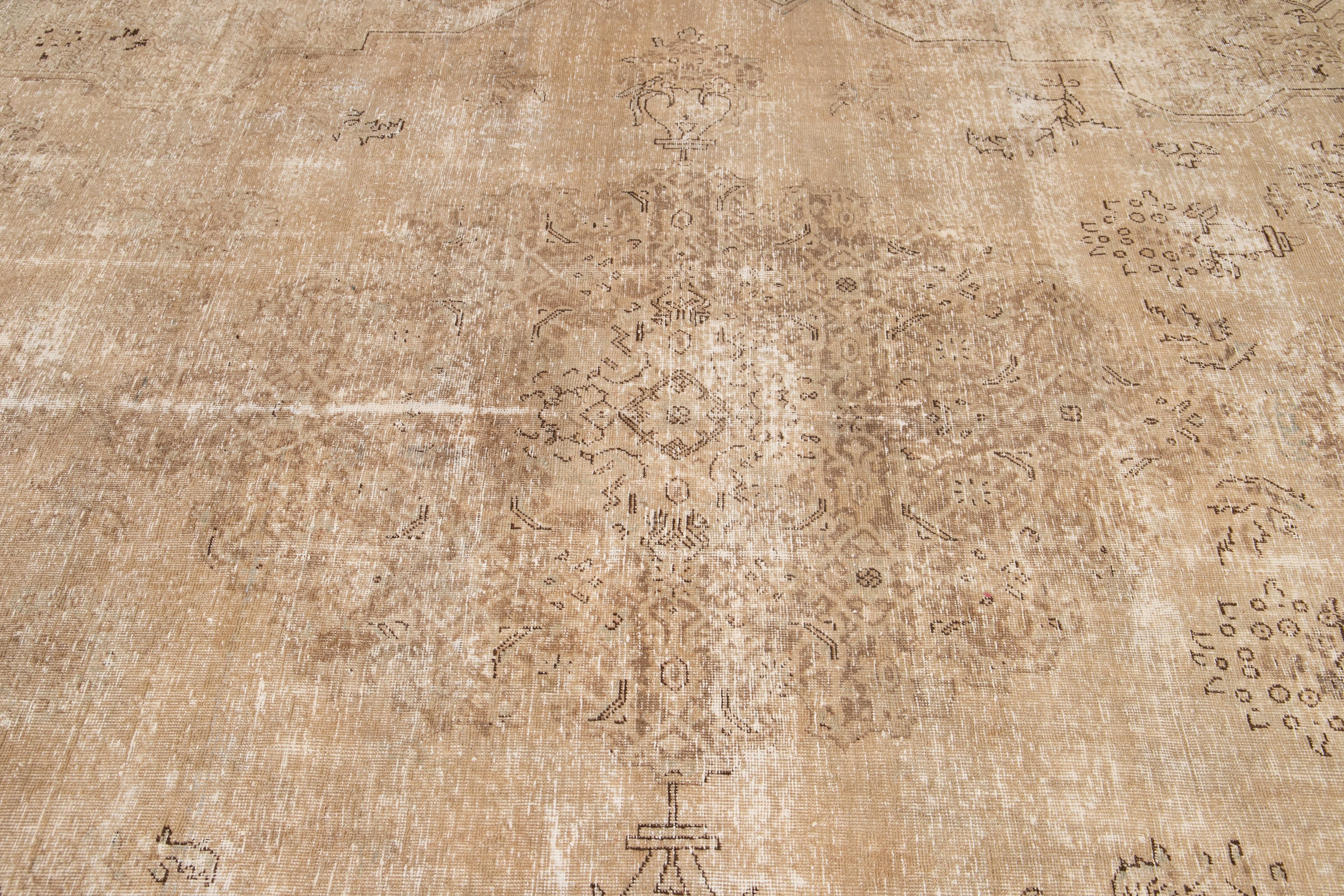 Mid-20th Century Vintage Distressed Tabriz Wool Rug For Sale 1