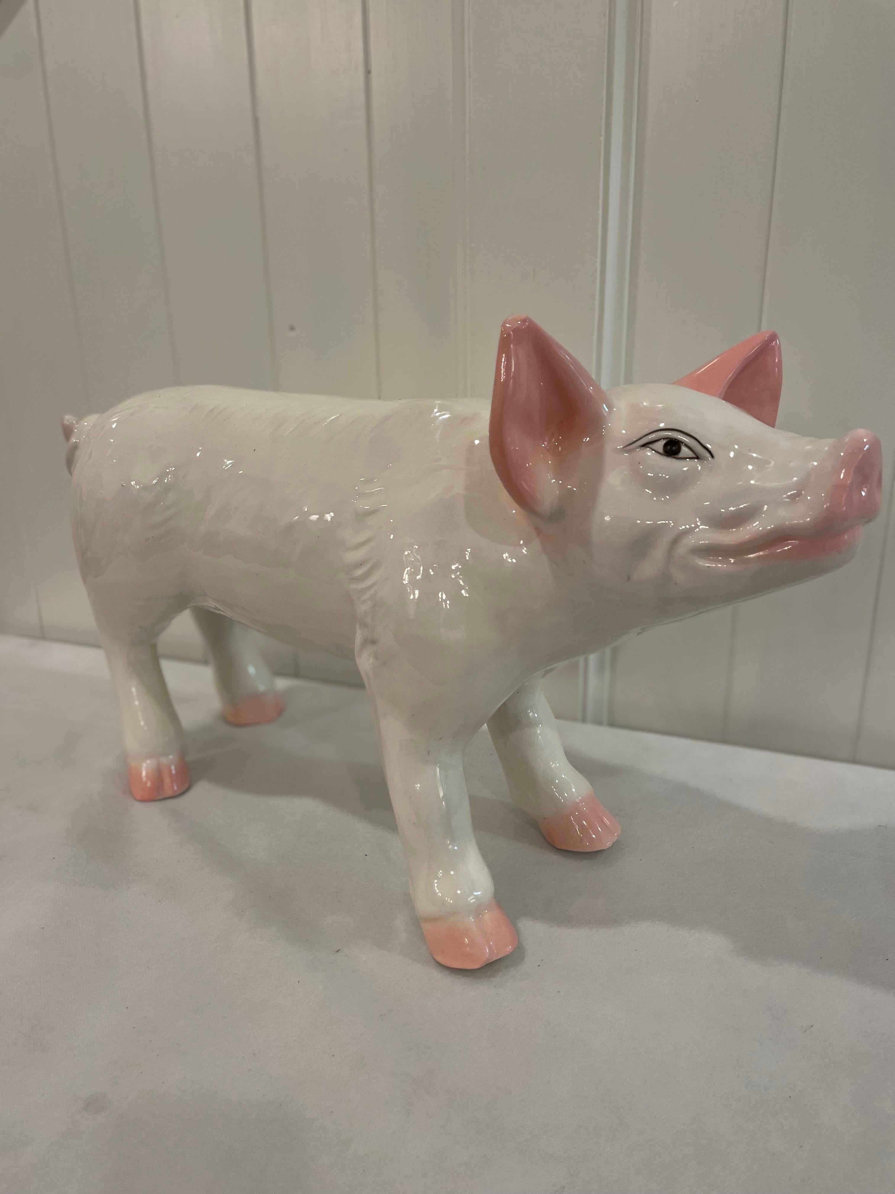 Decorate your kitchen counter with this superb sculptured, ceramic pig. Crafted, circa mid century the large pig figure is colorful, expressive, detailed, and realistic in shape and texture. The picturesque farm animal is in excellent condition with
