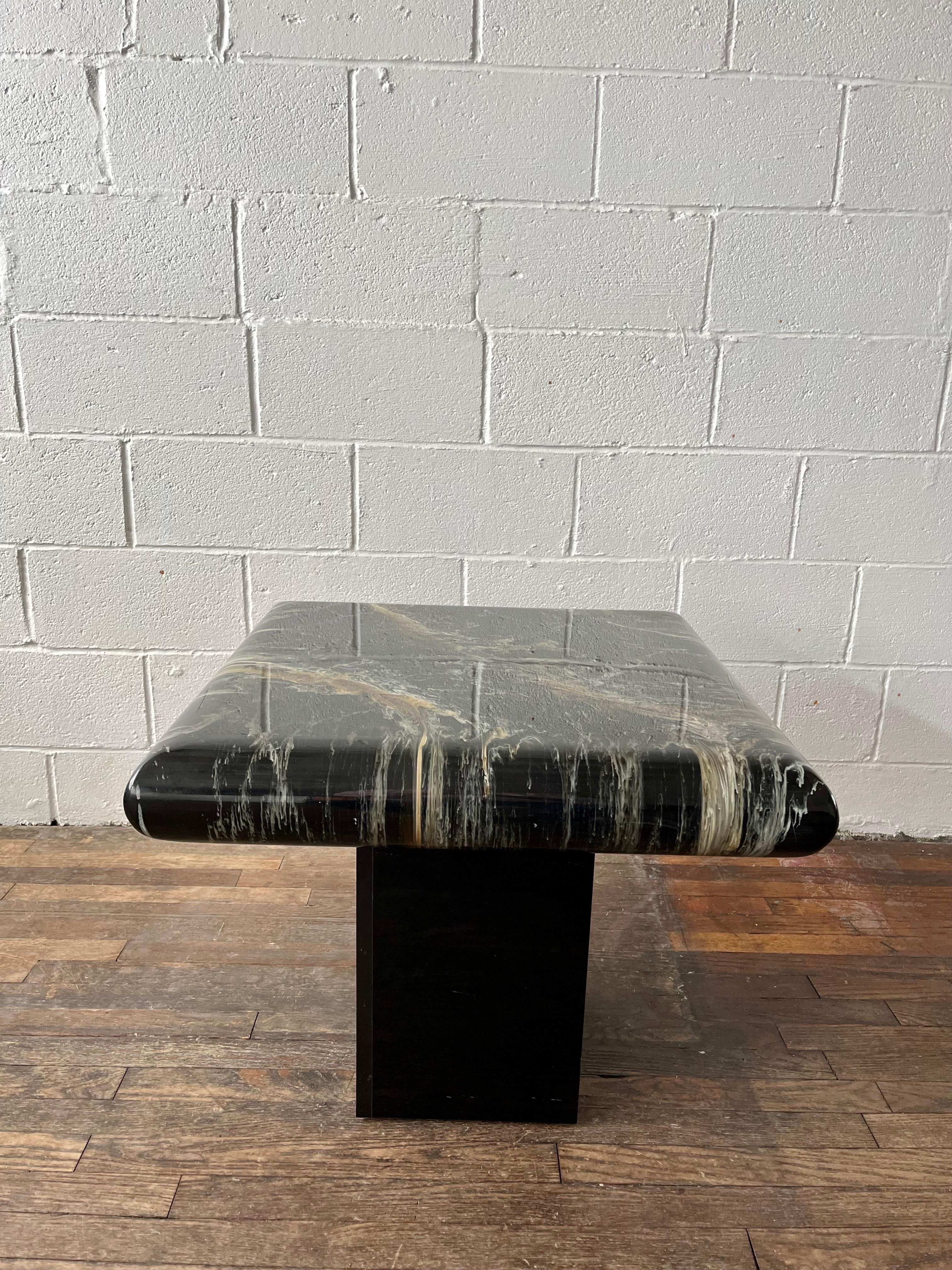Vintage Karl Springer inspired end table. All the right things with the faux marble, heavy curved edges and square laminate base. Deep movement with the faux marble veining.
Curbside to NYC/Philly $400