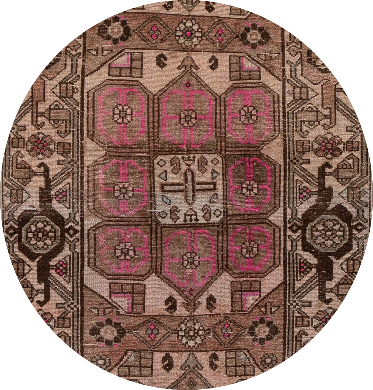 Beautiful vintage Malayer Persian runner rug with a brown field, pink and ivory accents with an all-over medallion design.

This rug measures 3'3