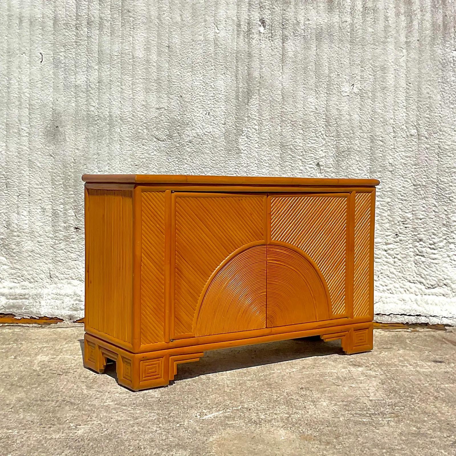 A gorgeous vintage mid-century bamboo cabinet to hold all of your favorite items. Acquired at a Palm Beach estate.