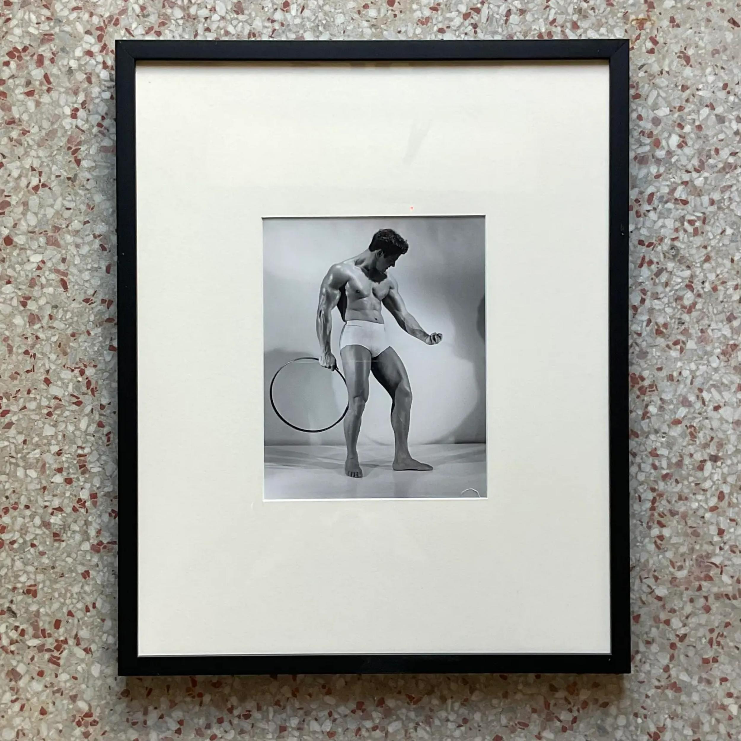 A fabulous Vintage MCM Framed Photograph of Athletic Man With Hoop. Shot by thr infamour a Bruce of LA. Purchased from the estate auction of thr artist.