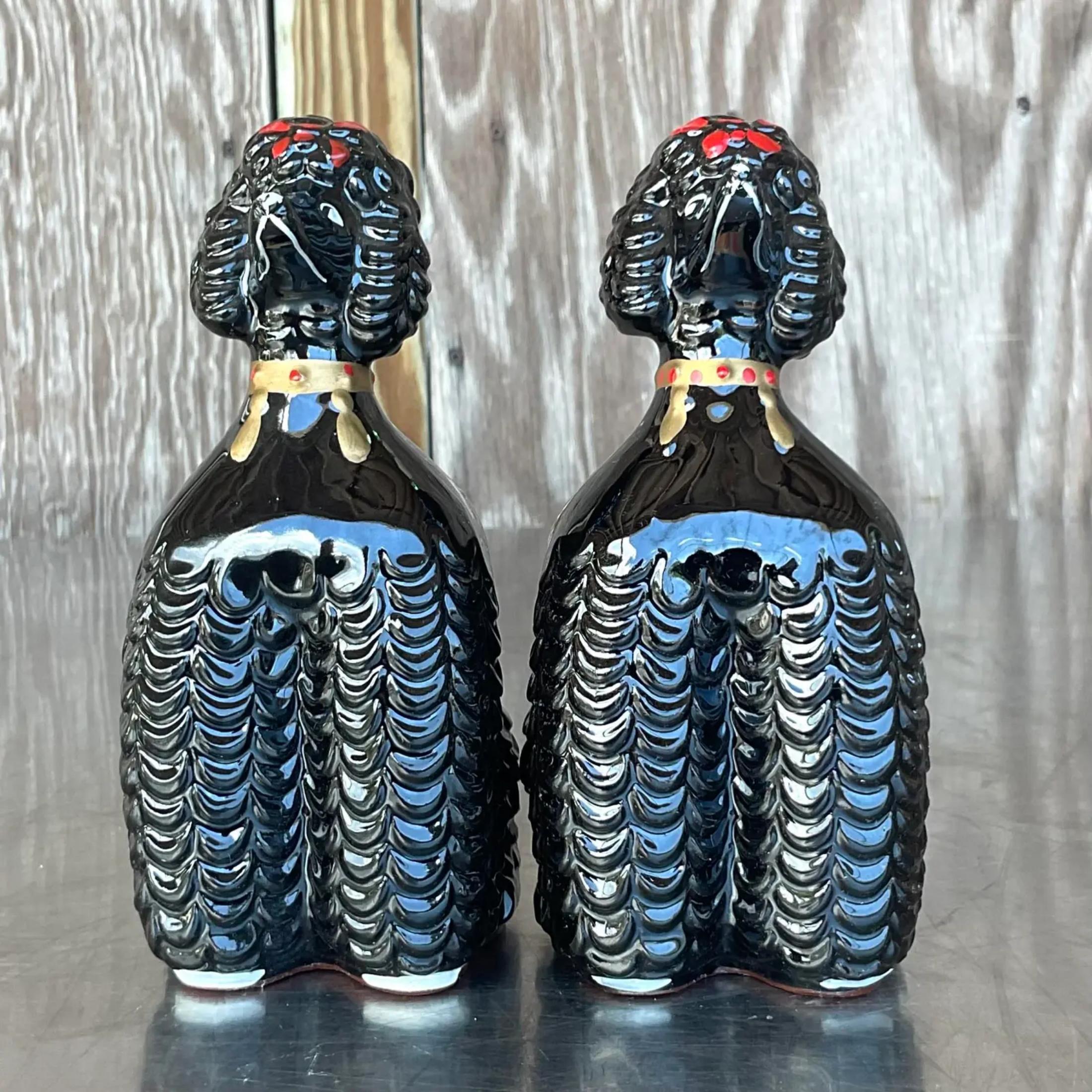 A fabulous pair of vintage MCM small planters. A charming pair of black poodles in a gloss ceramic finish. Hand painted detail. Perfect for your Desk or window box. Acquired from a Palm Beach estate.