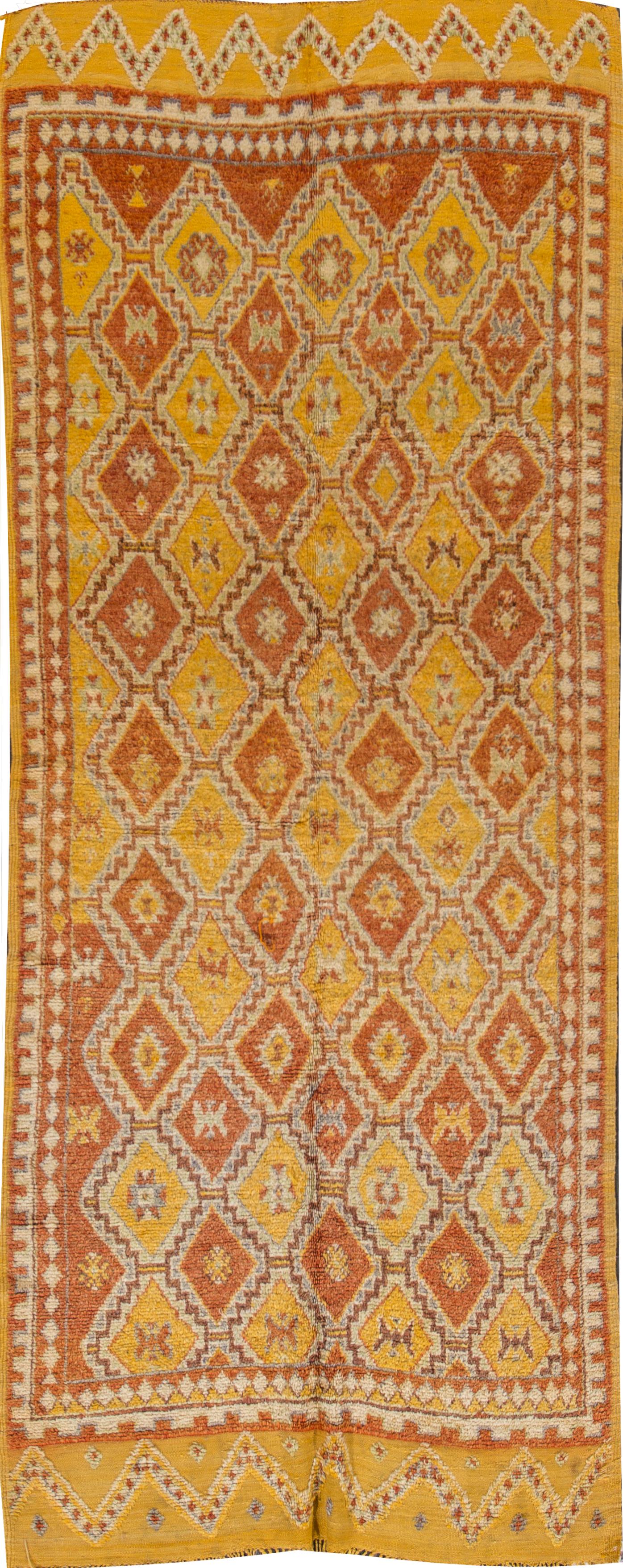 Beautiful Vintage Moroccan Rug, hand-knotted wool with a bright yellow field, orange accents in an allover tribal design.

This rug measures 4' 3