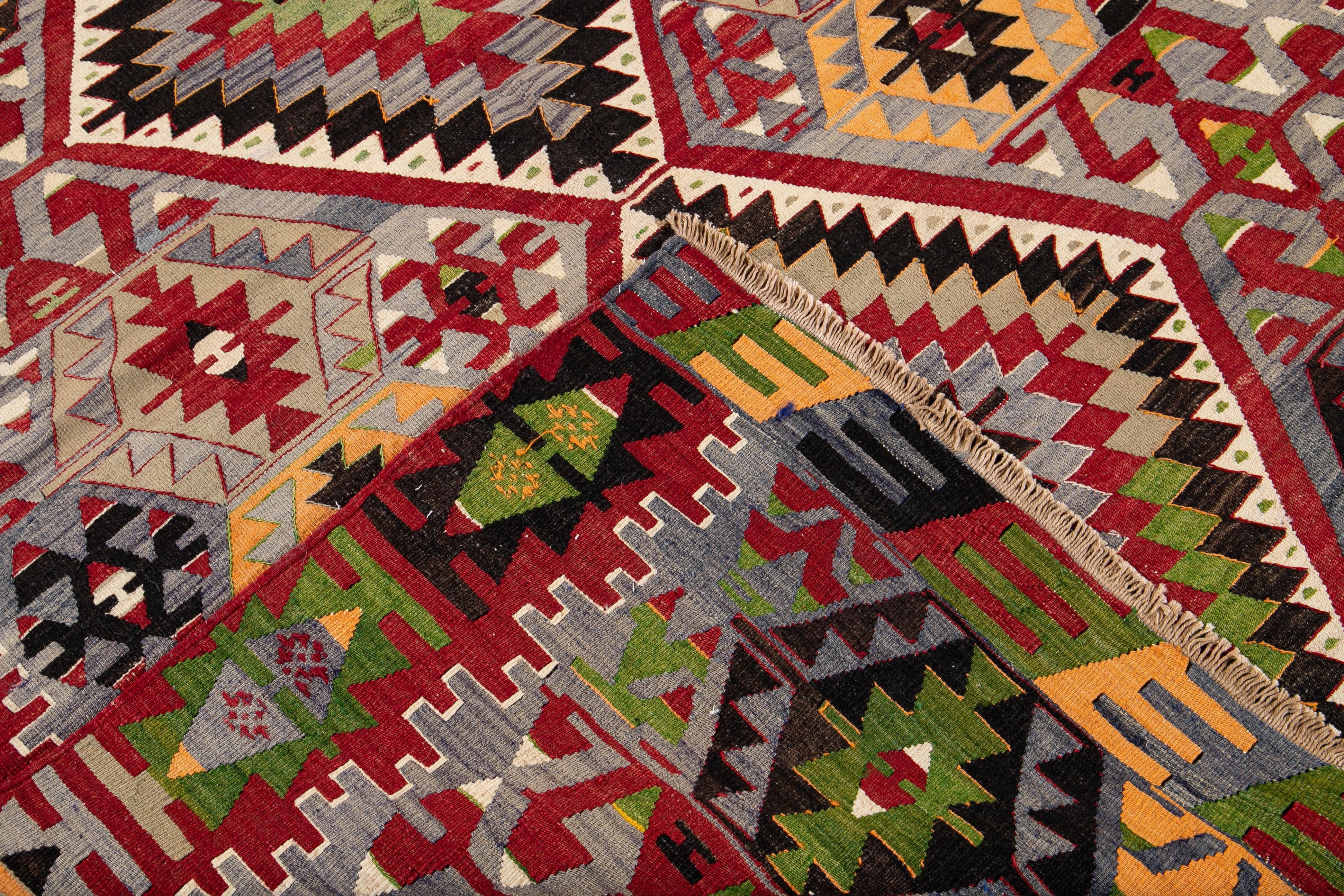 Hand-Knotted Mid-20th Century Vintage Multicolored Geometric Turkish Kilim Wool Rug