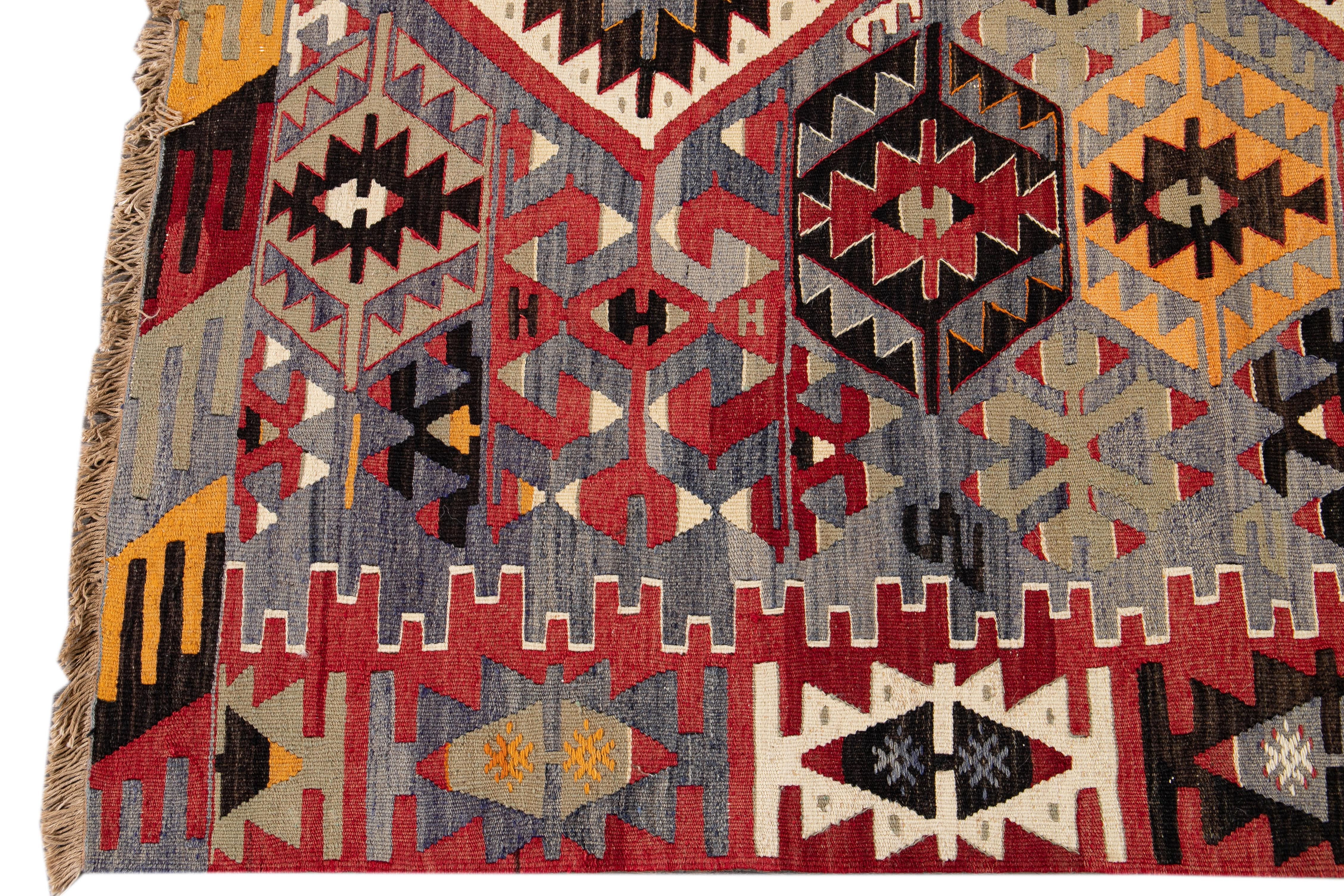 Mid-20th Century Vintage Multicolored Geometric Turkish Kilim Wool Rug 1