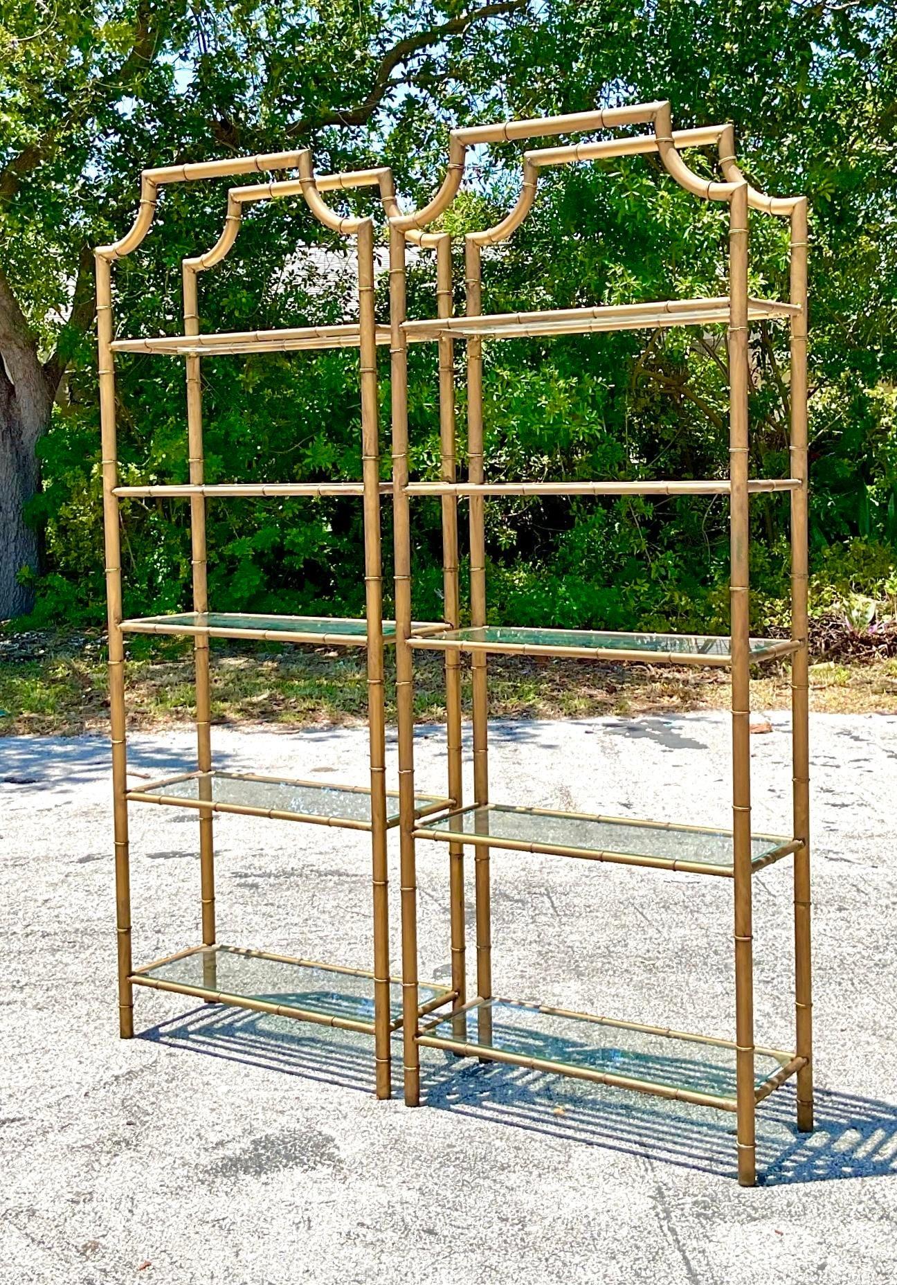 Transform your space with this pair of vintage Pagoda Burnished Brass Etagères, echoing classic American elegance. Crafted with meticulous attention to detail, these pieces bring a touch of sophistication and functionality, perfect for showcasing