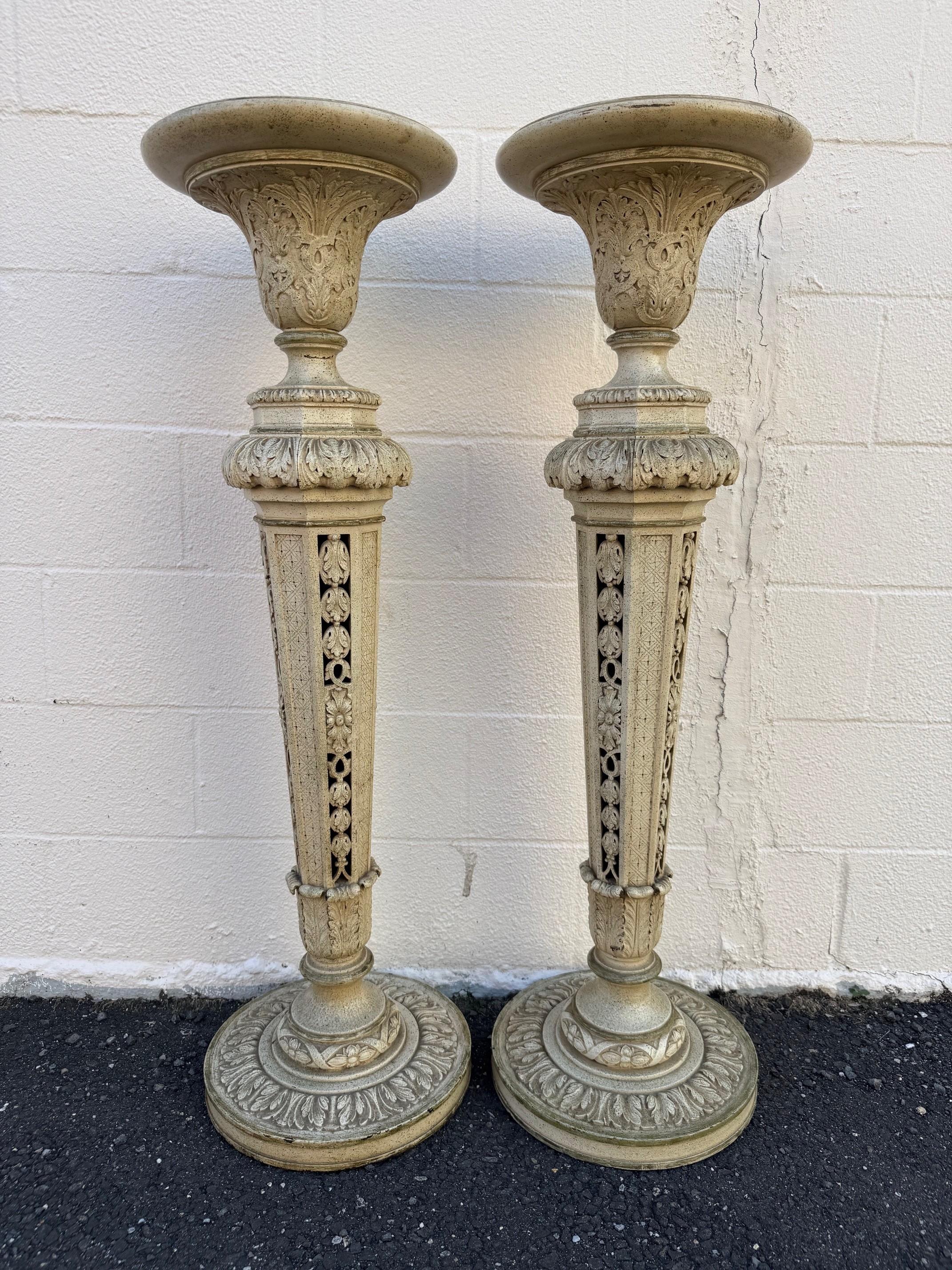 Beautiful pair of Mid Century vintage painted wood pedestals or plant stands. This pair of decorative stands or pedestals are reminiscent of
neoclassical design, which draws inspiration from the art and
architecture of ancient Greece and Rome. This
