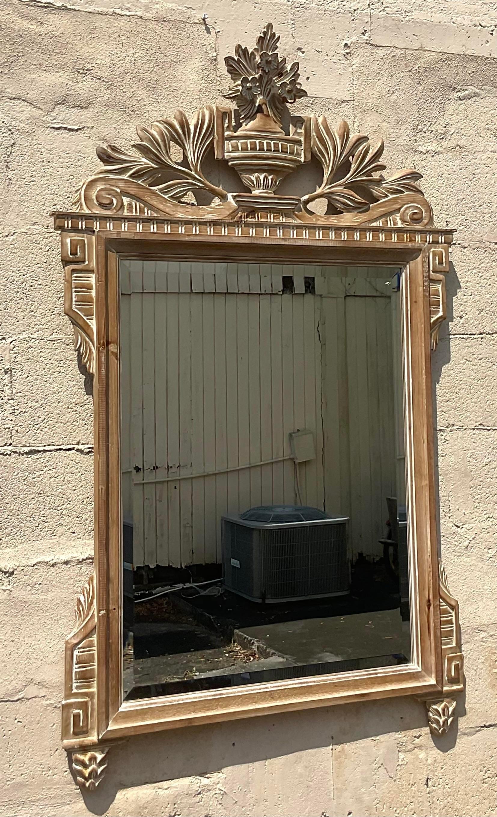 Elevate your decor with the timeless sophistication of this vintage Regency Italian carved wood mirror. Crafted with meticulous attention to detail, its ornate design and rich wood finish exude classic American style. Perfect for adding depth and