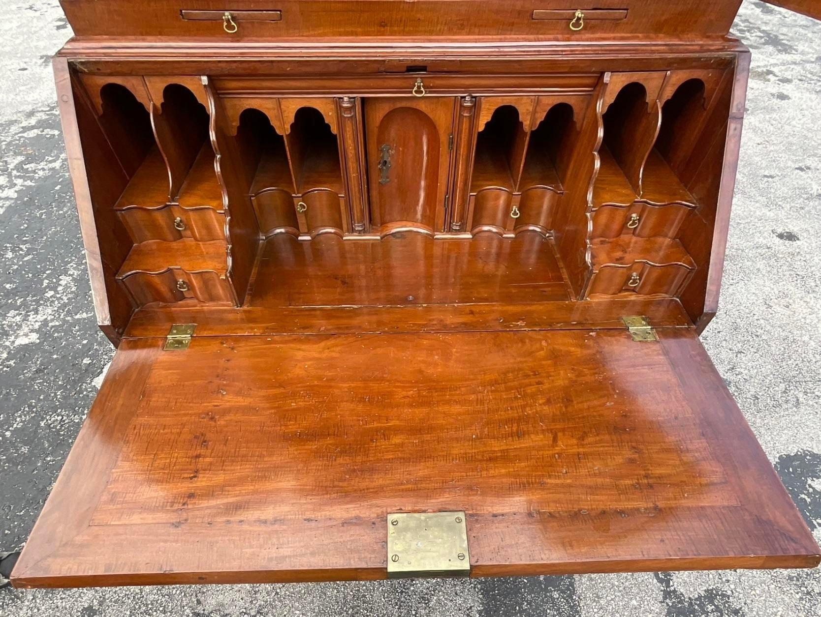 An exceptional vintage Regency desk. A soaring Secretary style with lots of little areas for storage. A beautiful Mahogany case that has a beautiful patina from time. Acquired from a Palm Beach estate.