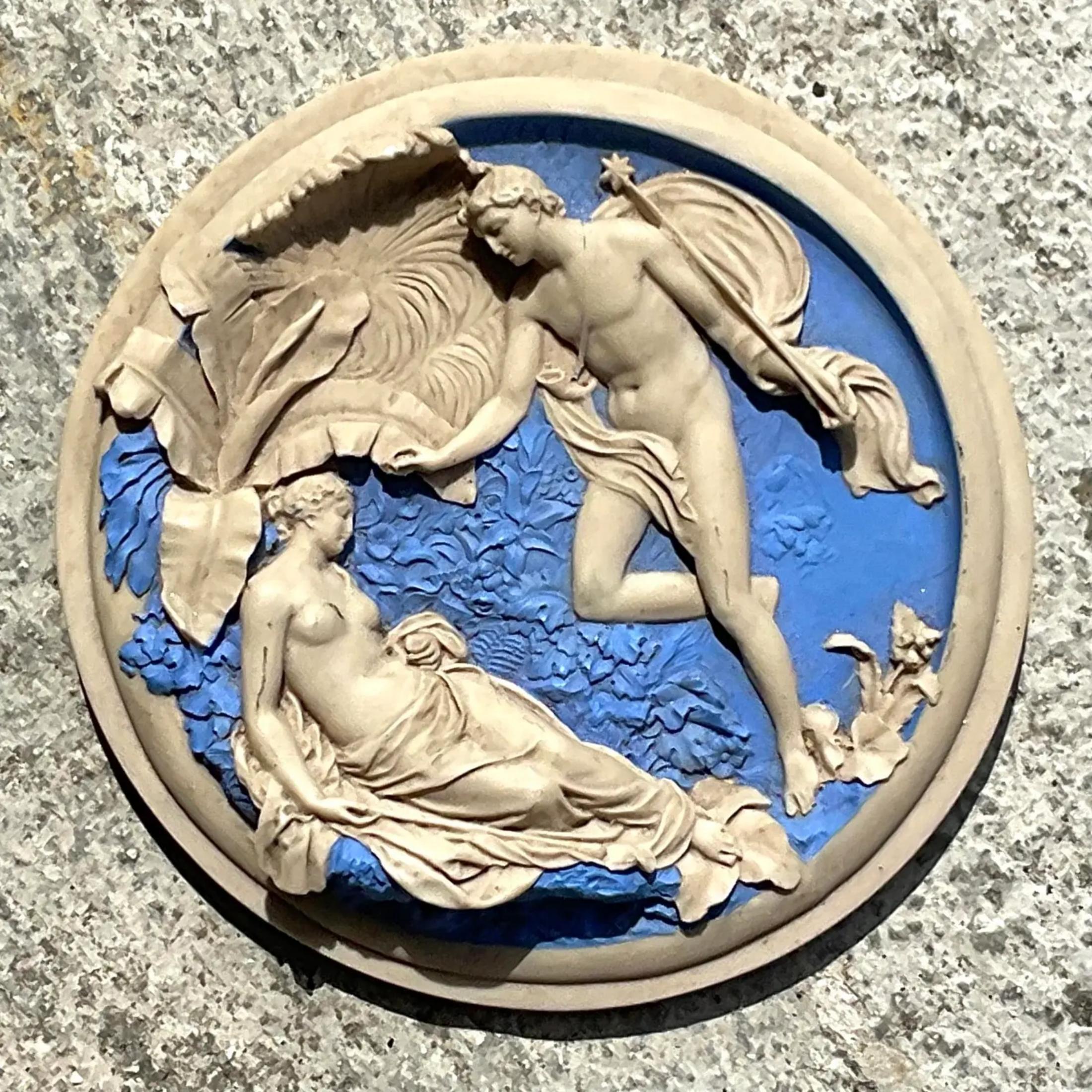 A fabulous vintage Regency medallion. A chic resin composite Frieze of a Mythological couple. A brilliant blue and white. Acquired from the estate of Massimo Camilo, the interior for Gianni Versace