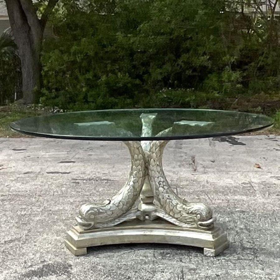 Make a statement in your foyer with this vintage Regency silver leaf koi center hall table. Reflecting American opulence and sophistication, its intricate design and gleaming finish add a touch of grandeur to any entrance, welcoming guests with