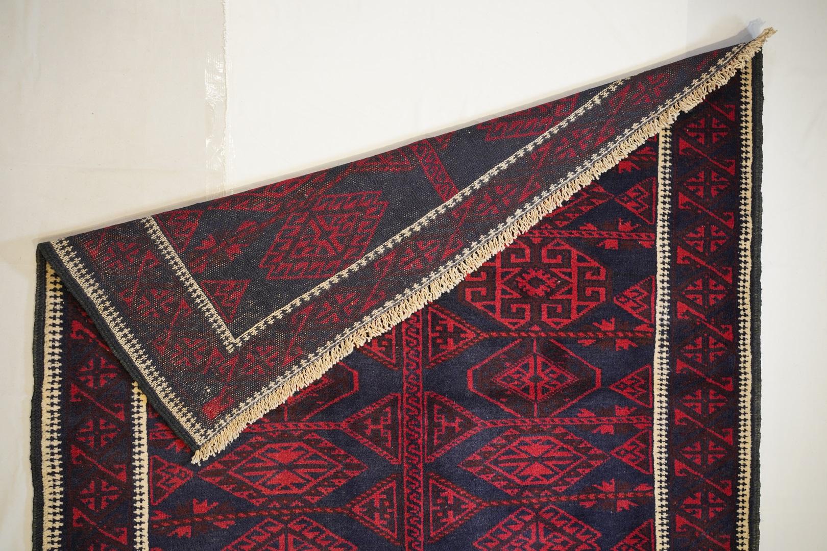 Baluch and Yamot Lamb’s wool
This excellent condition 60-70 year old  medium large Beluchi exemplifies the subtlety of presentation and the fine weaving of mid century Belouchi hand woven carpets . The USE OF BEAUTIFULLY ABRASED deep indigo is