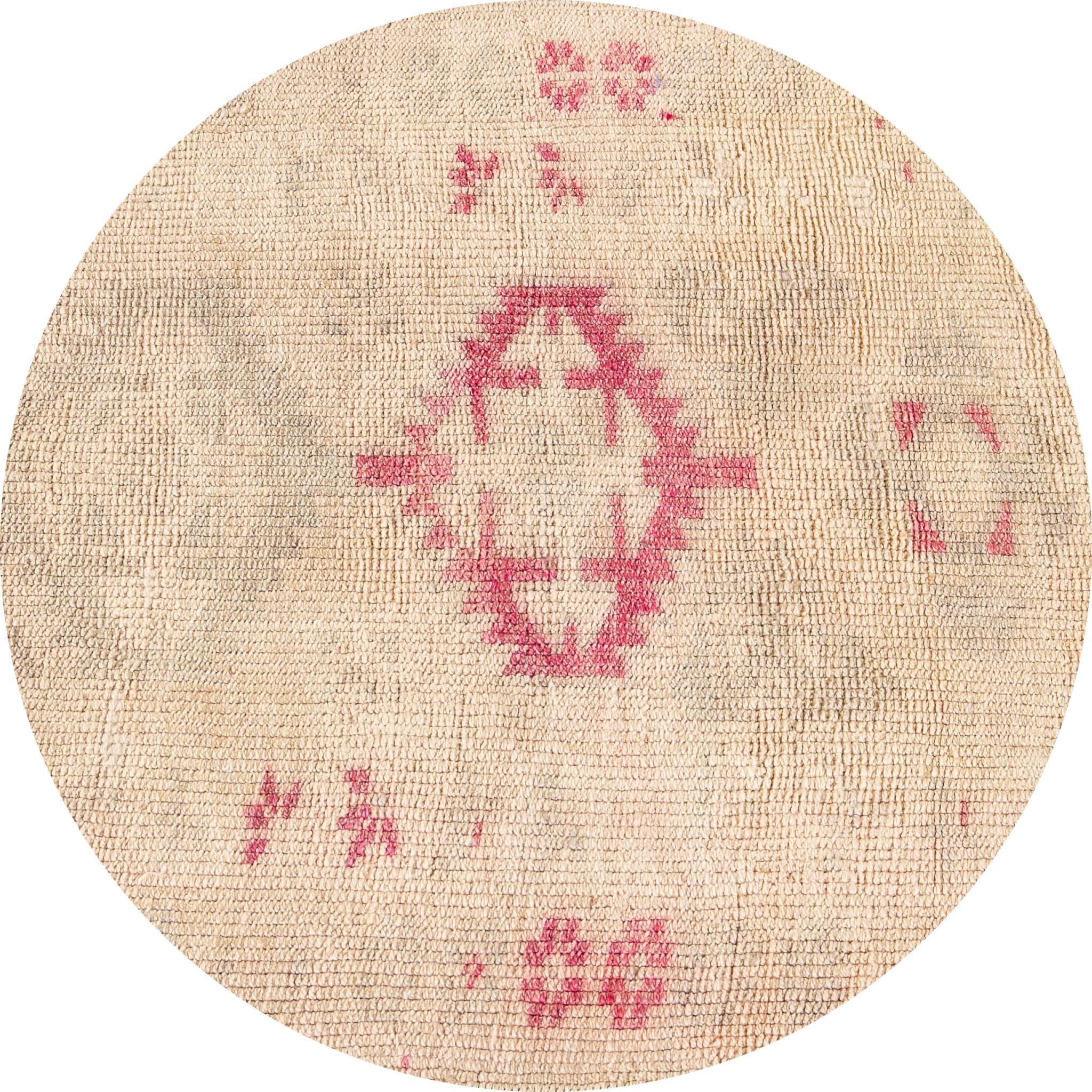 Beautiful vintage runner rug, hand knotted wool with a light tan field, tan and pink accents in multi medallion design, circa 1930.
This rug measures 2' 8