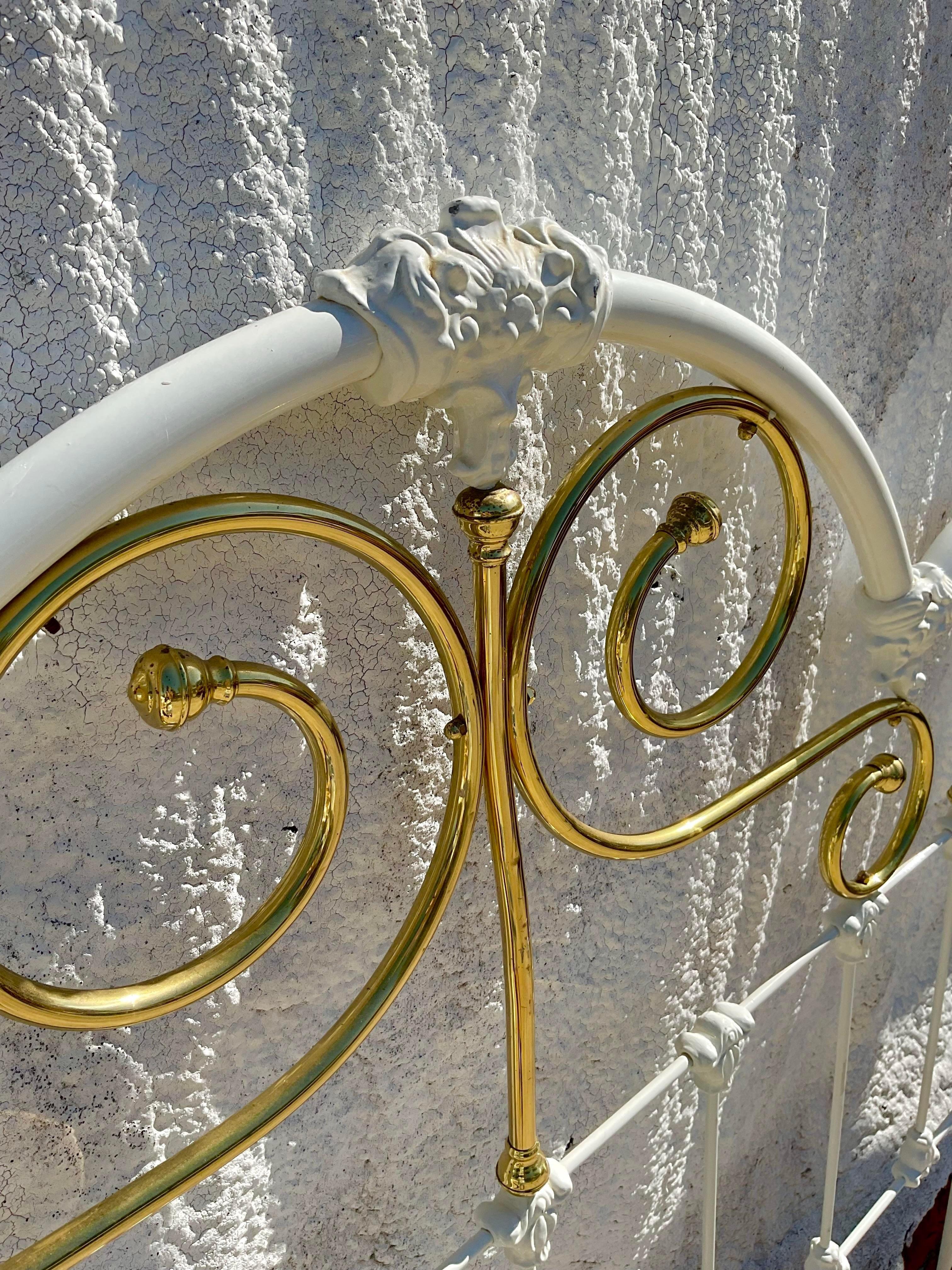 A fabulous vintage Wesley Allen queen bed made out of brass and painted in white with gold accents. We have the matching footboard that is included but listing as a headboard for those who would only want that. Acquired at a Palm Beach estate