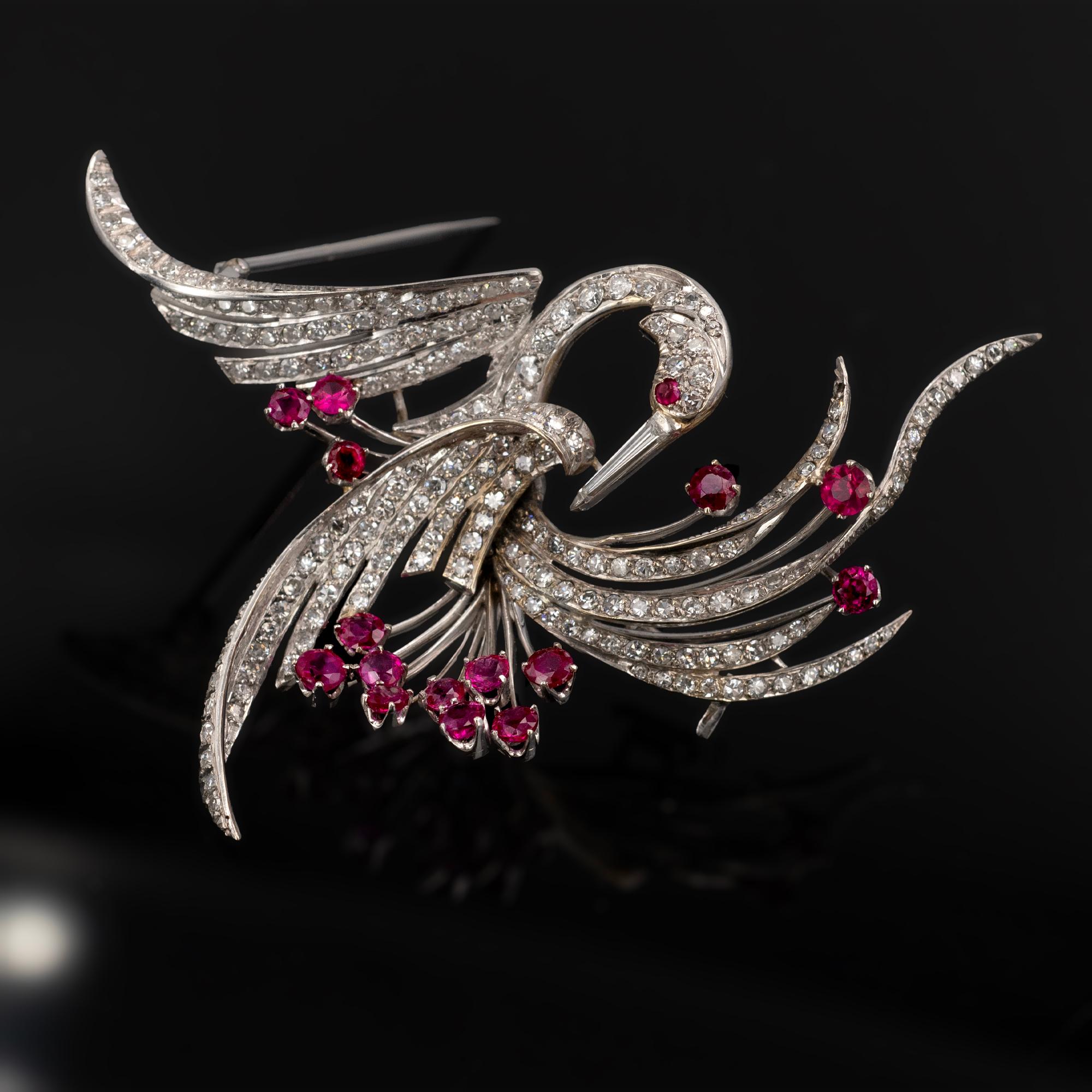 This brooch is a beautiful and timeless piece. It is crafted in white gold and measures 5 cm by 7 cm, making it the perfect size for any outfit. Designed to look like a stylized bird, the brooch is decorated with round pavé-set diamonds. These