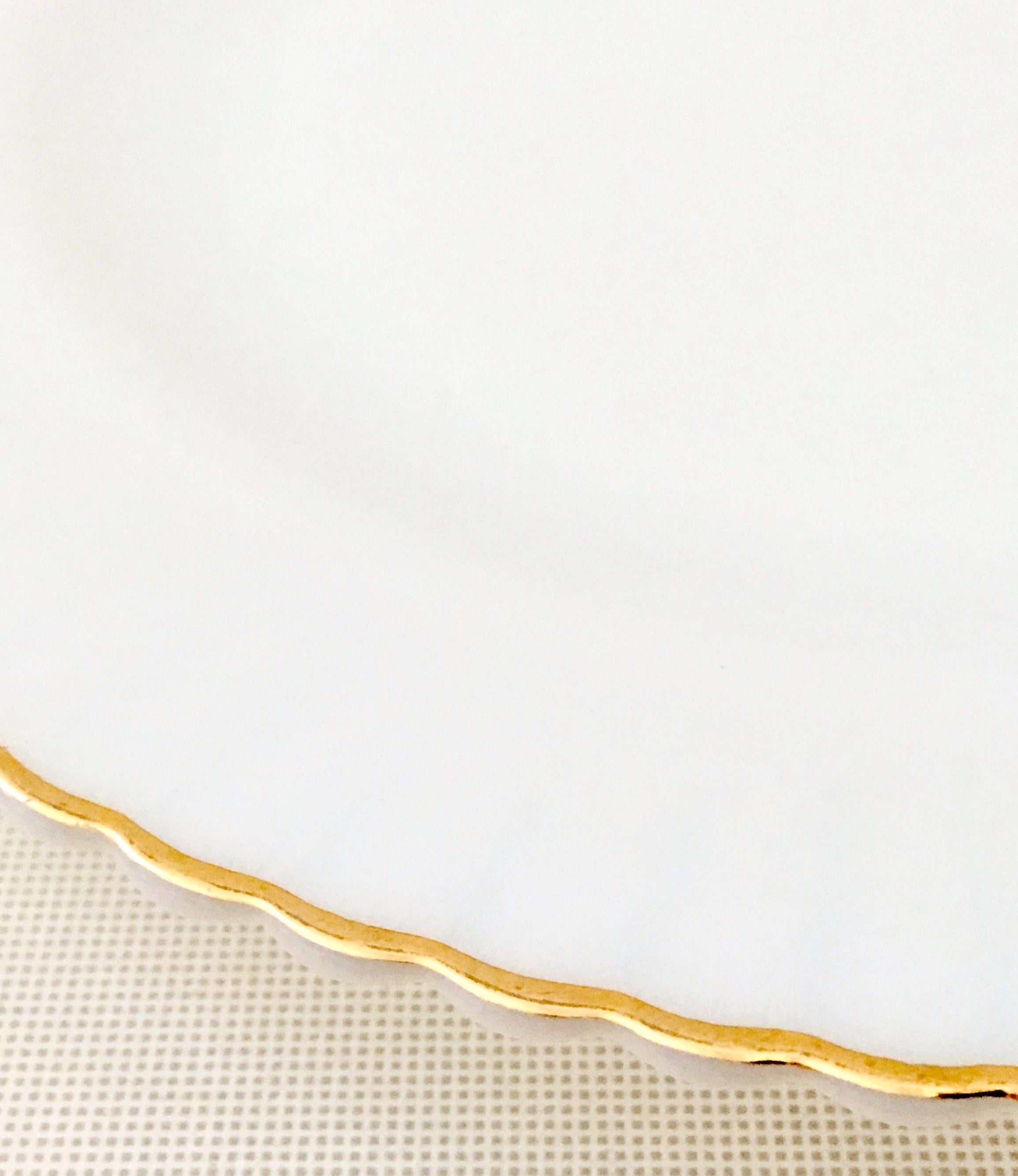 white plate with gold trim
