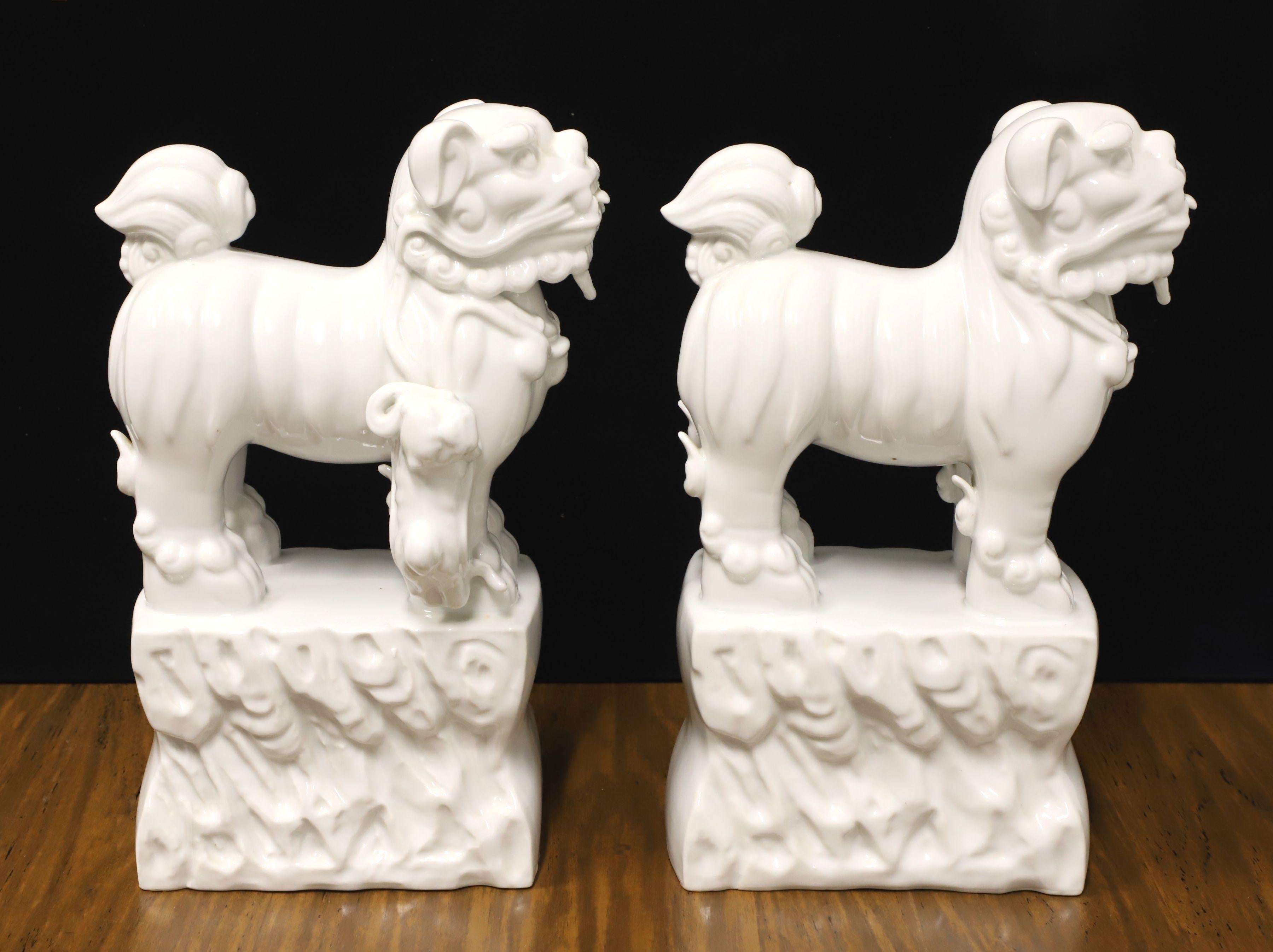Chinoiserie Mid 20th Century White Porcelain Foo Dogs - Pair For Sale