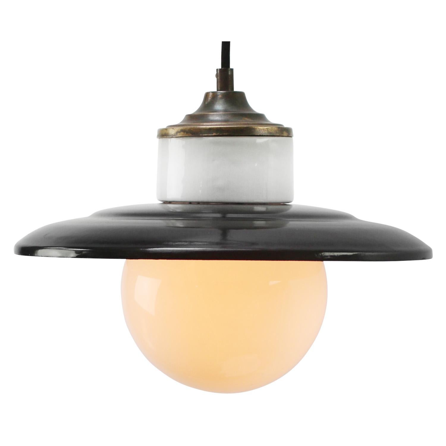 Porcelain industrial hanging lamp.
White porcelain, brass and white opaline milk glass.
Black enamel shade
2 conductors, no ground.

Weight: 1.70 kg / 3.7 lb

Priced per individual item. All lamps have been made suitable by international standards