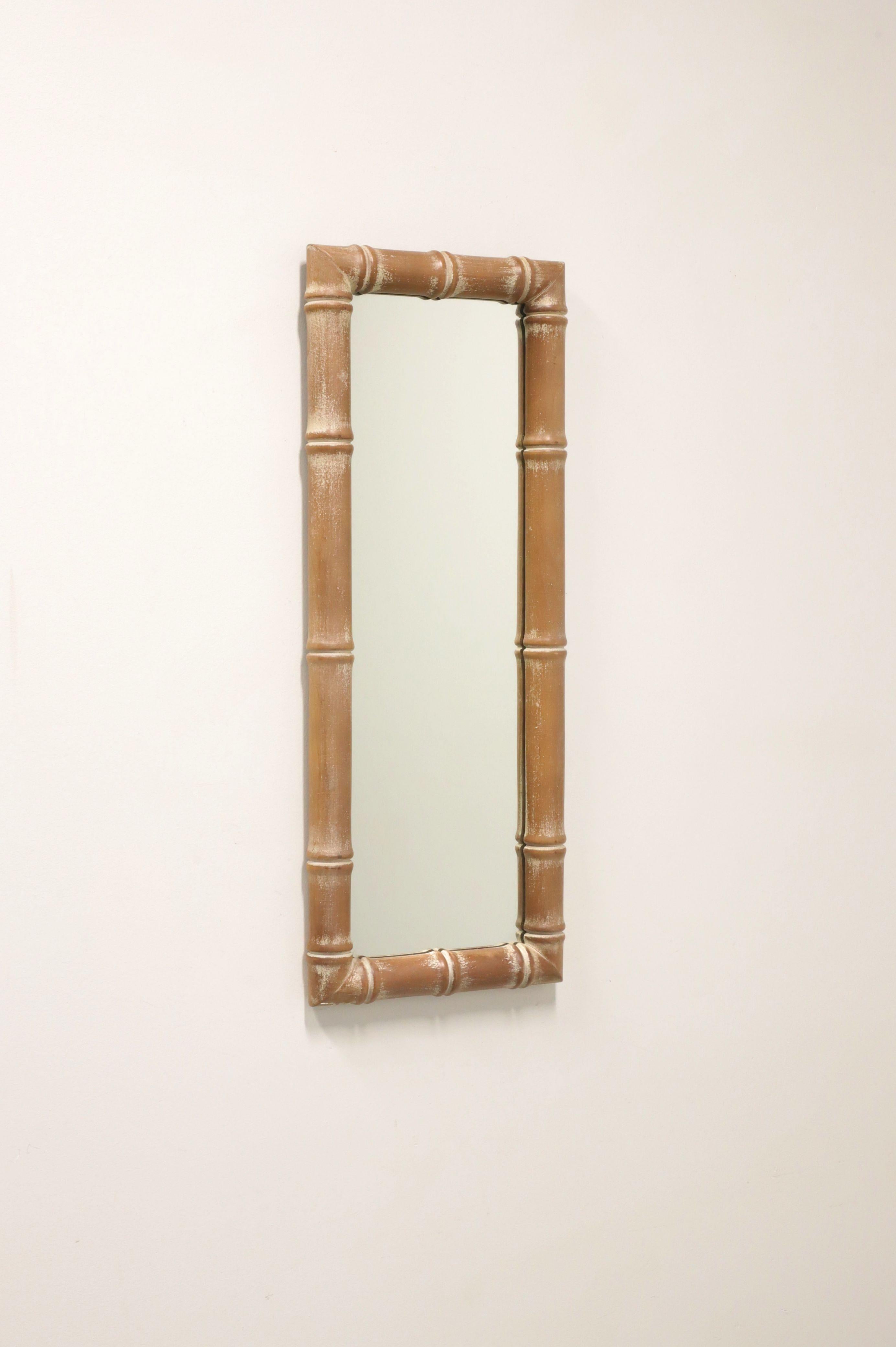 An Asian Influenced wall mirror, unbranded. Mirrored glass in a rectangular shaped whitewashed brown color faux bamboo frame. Made in Spain, in the mid 20th Century. 

Measures: 13.25w 2d 34.5h, Weighs Approximately: 10lbs

Exceptionally good