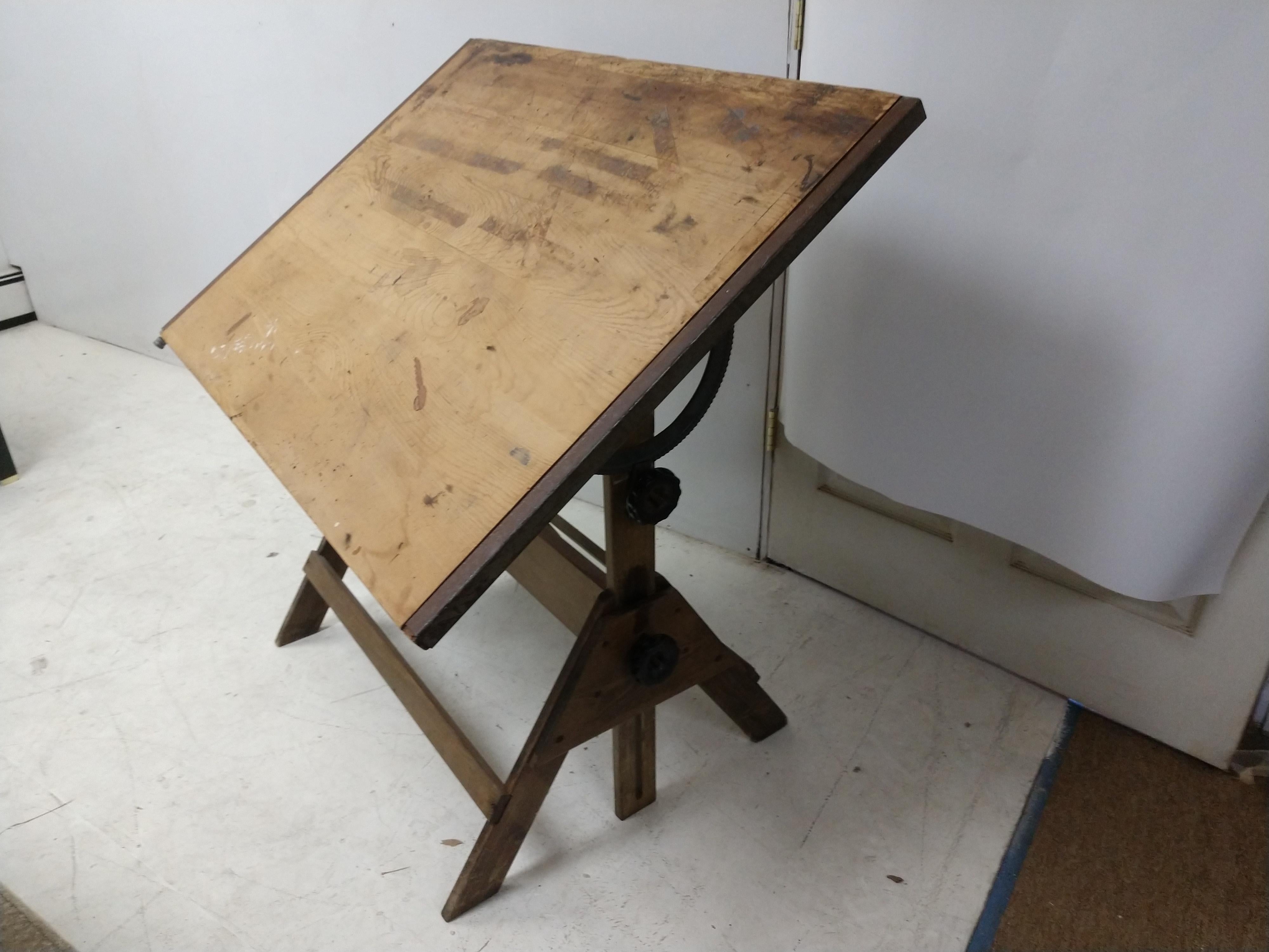 Well built Anco drafting table. Fully adjustable raises and lowers from a height of 33 in. to 45 in. Any angle you prefer. Top is 42.25 x 31. Very sturdy with no issues.