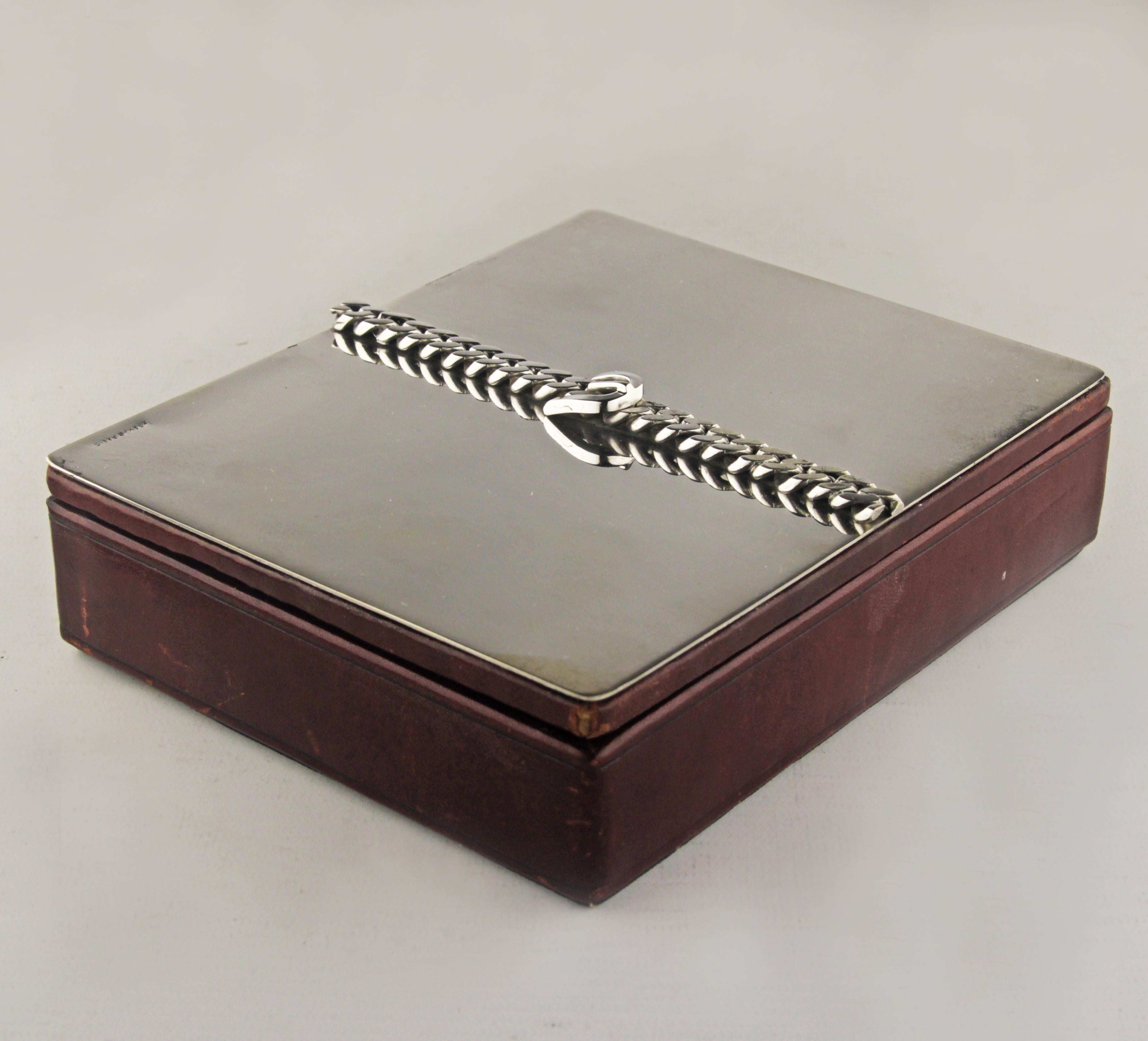 Mid-20th century wooden box with silver buckle lid by french luxury design house Hermès Paris

By: Hermès Paris
Material: fabric, silver, wood
Technique: cast, plated
Date: mid-20th century
Style: Mid-20th Century Modern
Place of origin: