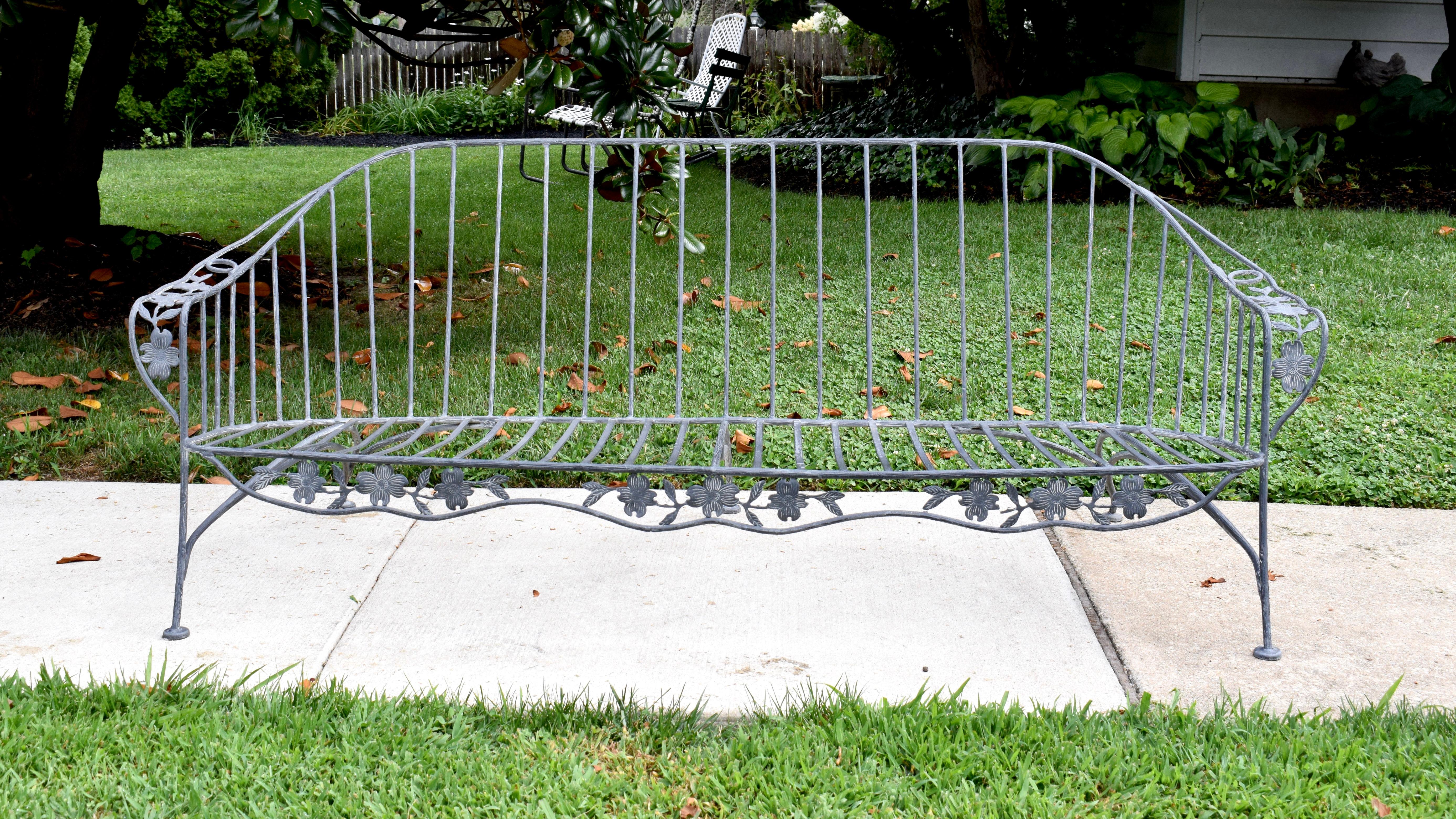 An unusual wrought Iron Faux Bois Patio or Garden sofa in the form of true Dogwood. Very heavy solid construction with gorgeous Gazelle styling to the legs, circa 1960's; USA. Unknown maker, quite substantial in the manner of Russel Woodard in