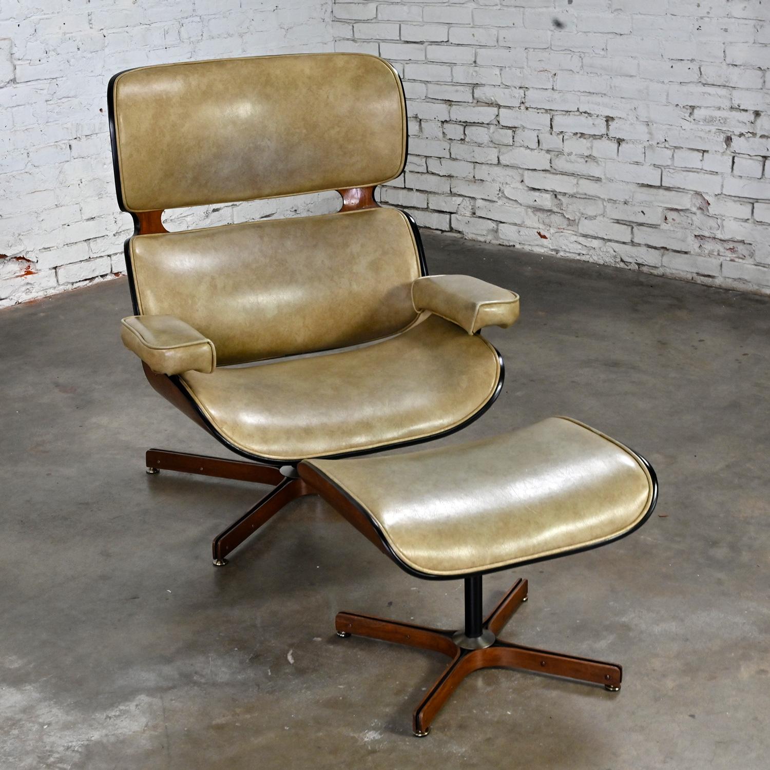 Fabulous Mid Century Modern “The Mr. Chair” lounge chair & ottoman by George Mulhauser for Plycraft comprised of walnut bentwood frames or shells, tan vinyl or faux leather, black painted shafts & 4 prong swivel & recline bases with walnut edges &