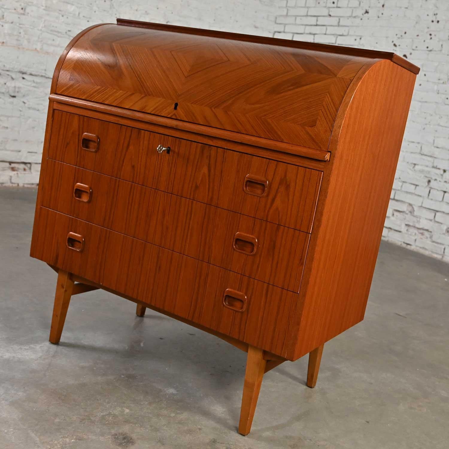 Gorgeous vintage Scandinavian Modern Svegards Markaryd teak roll top secretary desk or dresser with original key attributed to Egon Ostergaard. Beautiful condition, keeping in mind that this is vintage and not new so will have signs of use and wear.