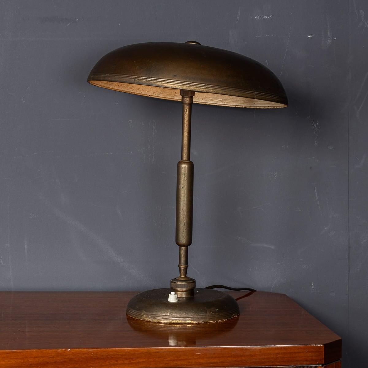 Mid 20th Century versatile bronze lamp with adjustable height and angle, featuring a sleek design attributed to Giovanni Michelucci. Giovanni Michelucci (1891–1990) was a distinguished Italian architect and designer, renowned for his modernist