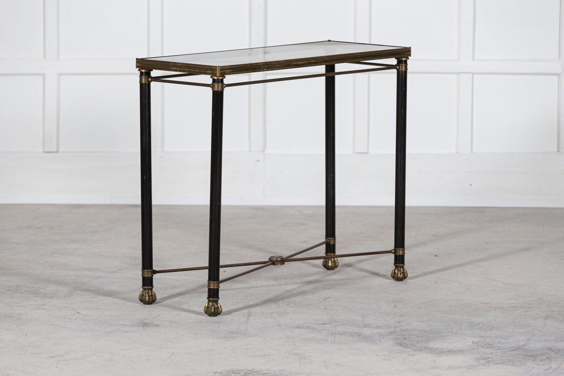 Circa 1950.
Mid 20th C French empire style console table.
Gilt metal inset glazed top, base with X stretcher and claw feet.
Sku 1137.
W90 x D36 x H78cm.