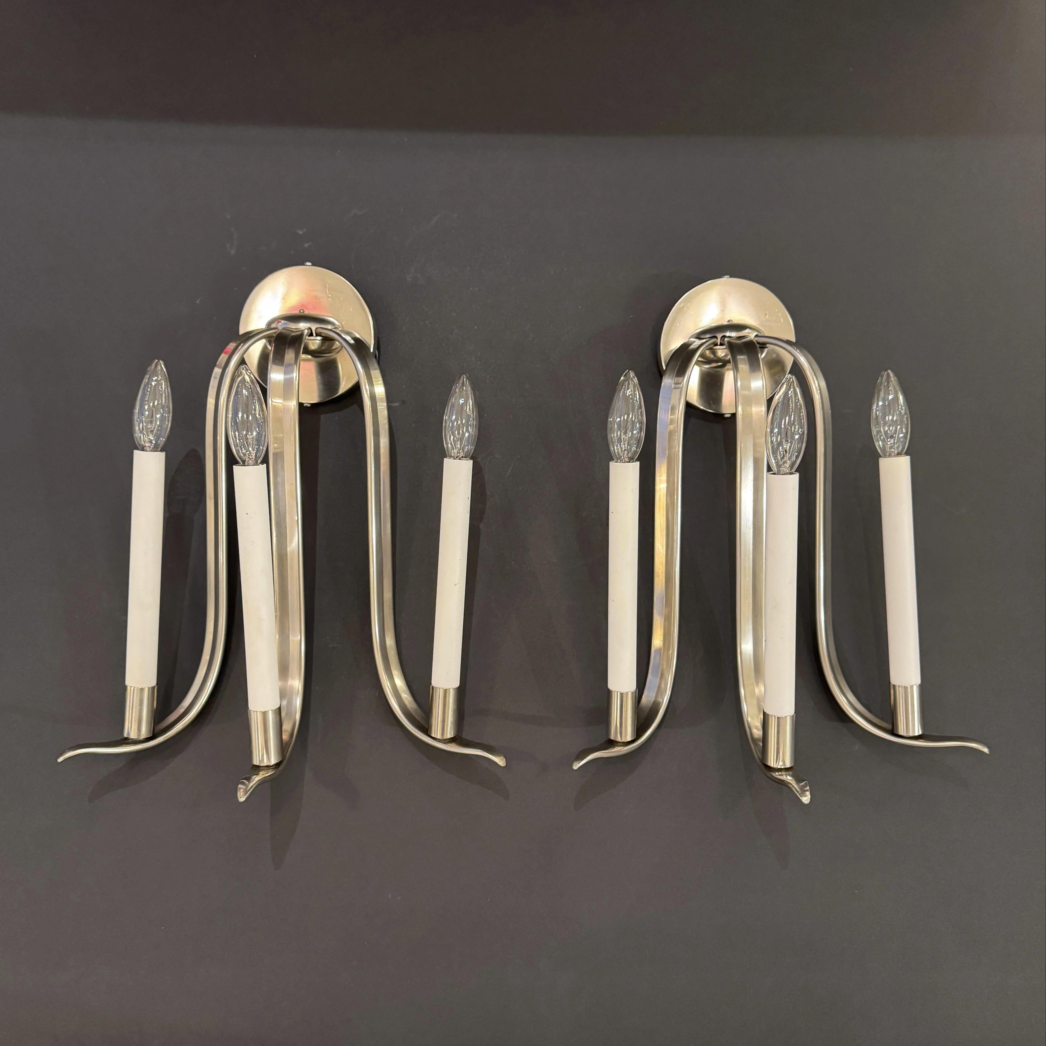 A pair of Art Deco period three arm sconces from Germany circa 1930. 