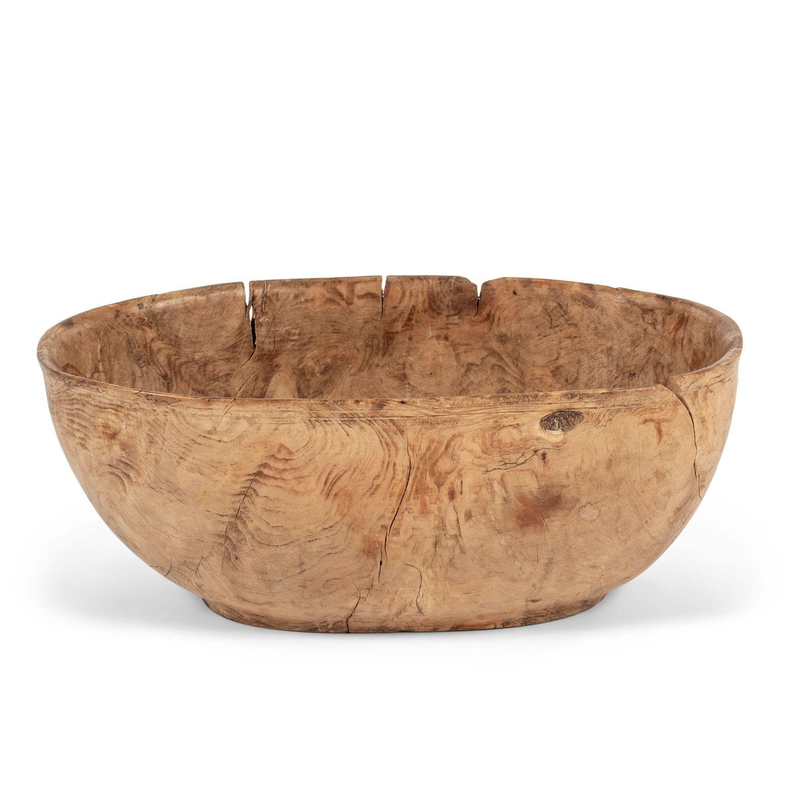 Mid-brown gorgeous Swedish oval-shaped burl root wood bowl dating to the 19th century. Hand-carved from burl fruitwood. Beautiful burl grain and dry patina.

Note: Due to regional changes in humidity and climate during shipping, antique wood may