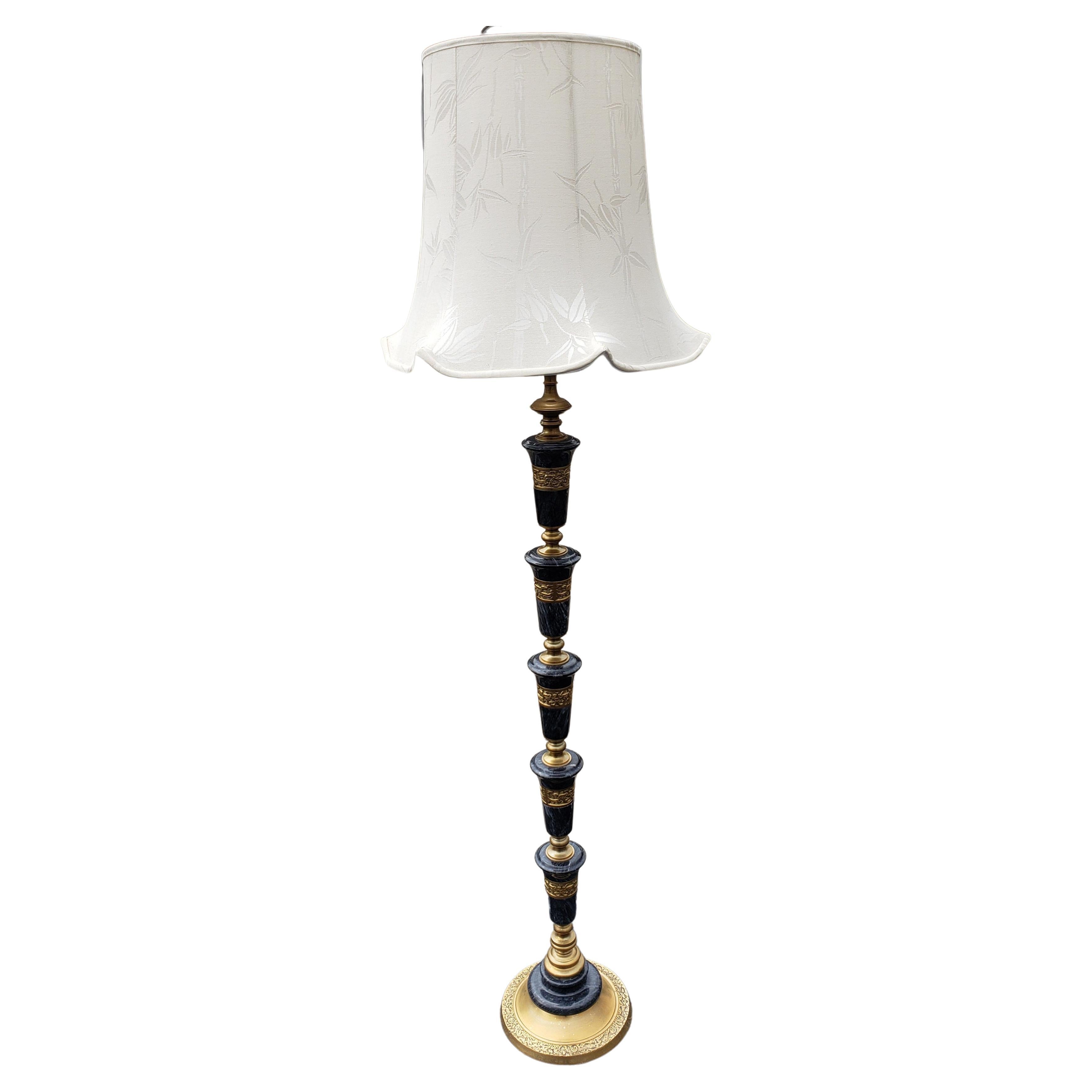 Mid-century Frederick Cooper Asian Regency marble and brass floor lamp. Dark Grey bluish marble with a Asian motif throughout the brass. Original harps that is 9.75in height.
Very heavy lamps, about 21lbs.
Measures: 10