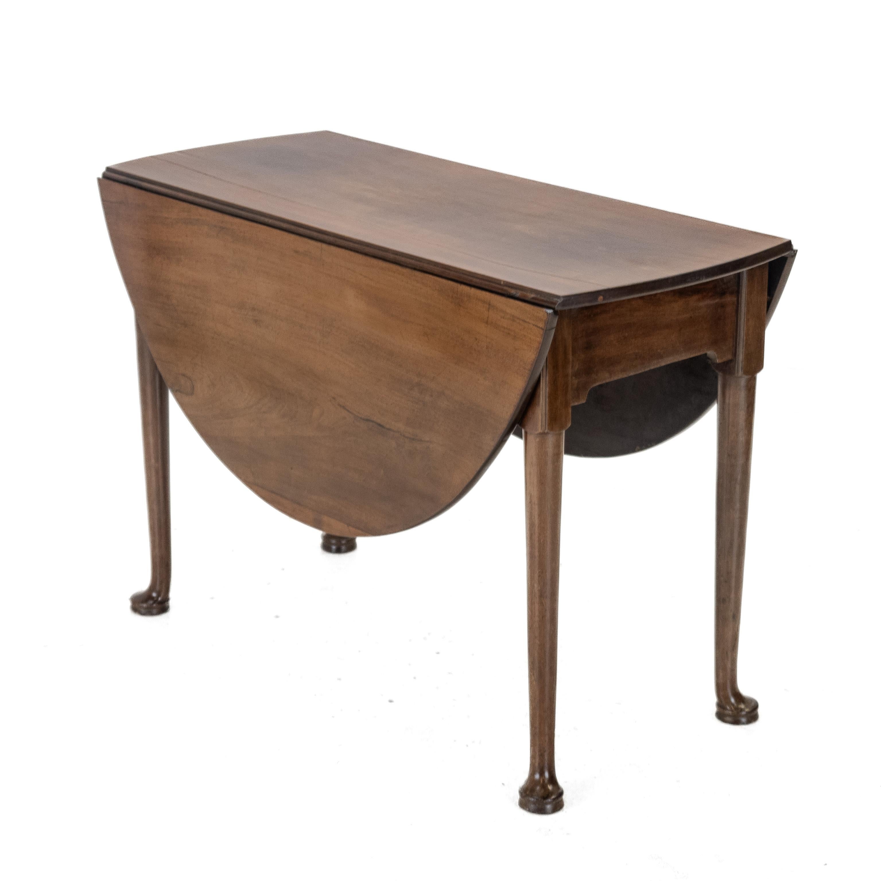 George II Mahogany Oval Drop-Leaf Gateleg Table, Circa 1750

A George II period mahogany oval drop-leaf gateleg table, dating from the mid-18th century. The well-figured solid mahogany top is of oval form, each leaf supported by a single gateleg
