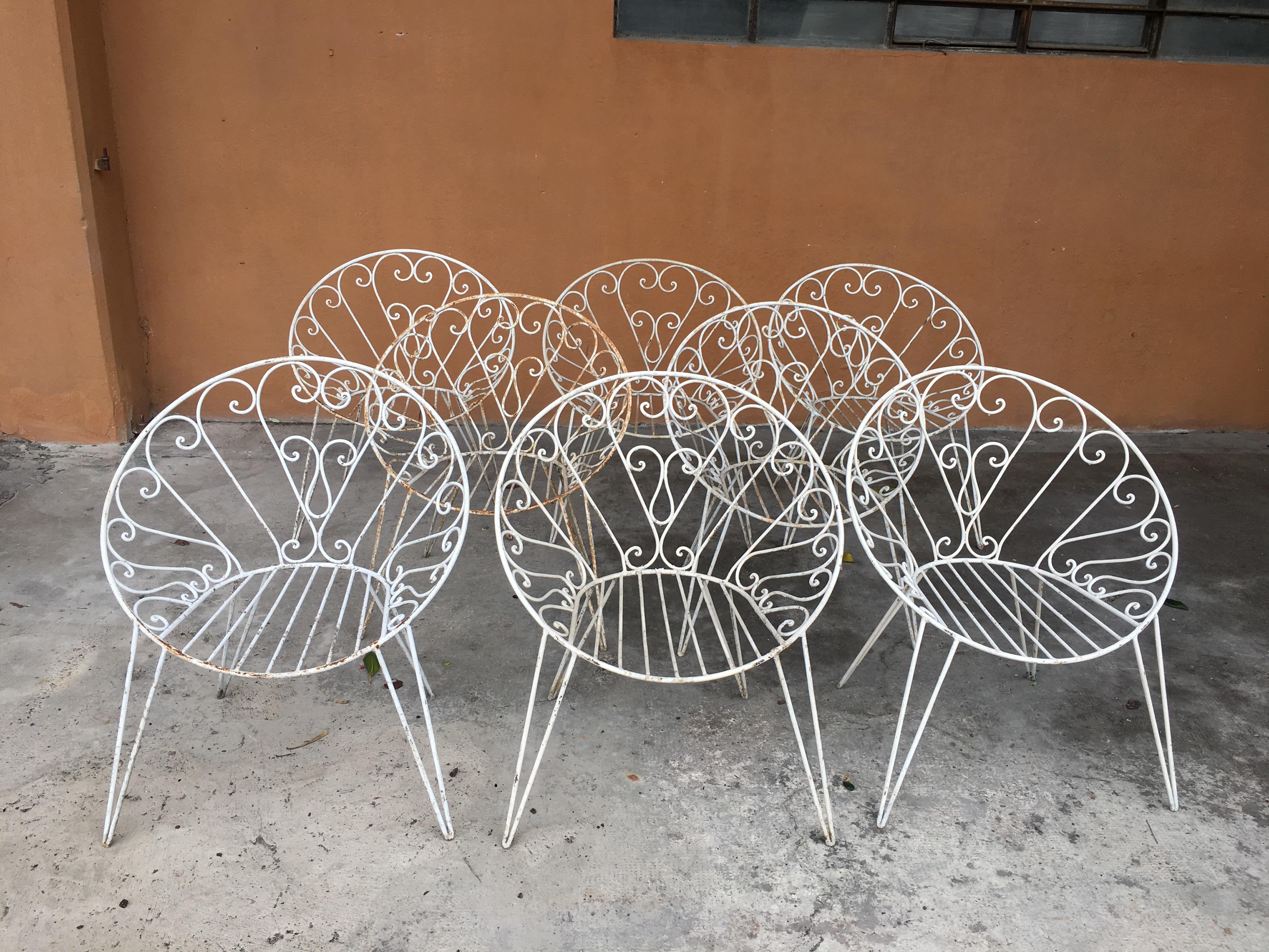 Mid-Century Modern French set of 8 white lacquered iron garden or patio chairs, 1960s
These chairs could become a set with their iron table base shown in the picture. Price on request.