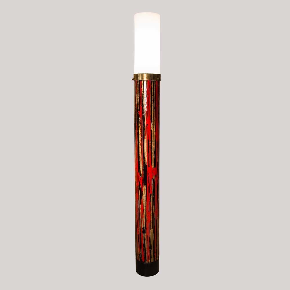 An original midcentury floor lamp. Abstract artistic multi colored enameled cylindrical metal structure with a white cylindrical acrylic shade. Italian design by Angelo Brotto for Esperia
This lamp is very much the expression of the happy midcentury