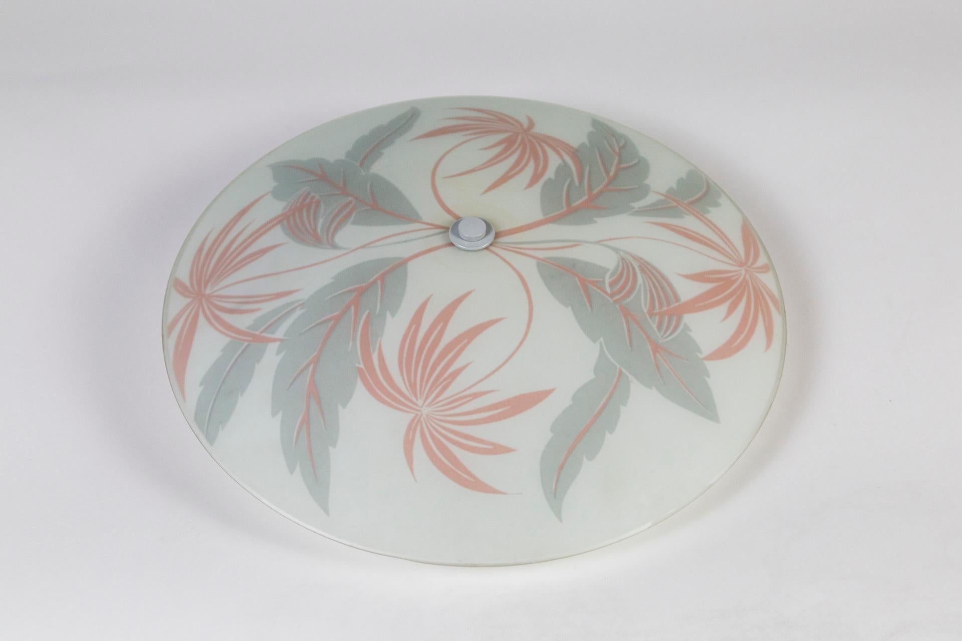 Palm Beach style, frosted glass, curved disk wall or ceiling light with printed pale gray and coral flora, 1950s glass newly wired with a 3-light cluster. The price listed is for one light. We have two available ($1,300 for 2 lights). Measures: