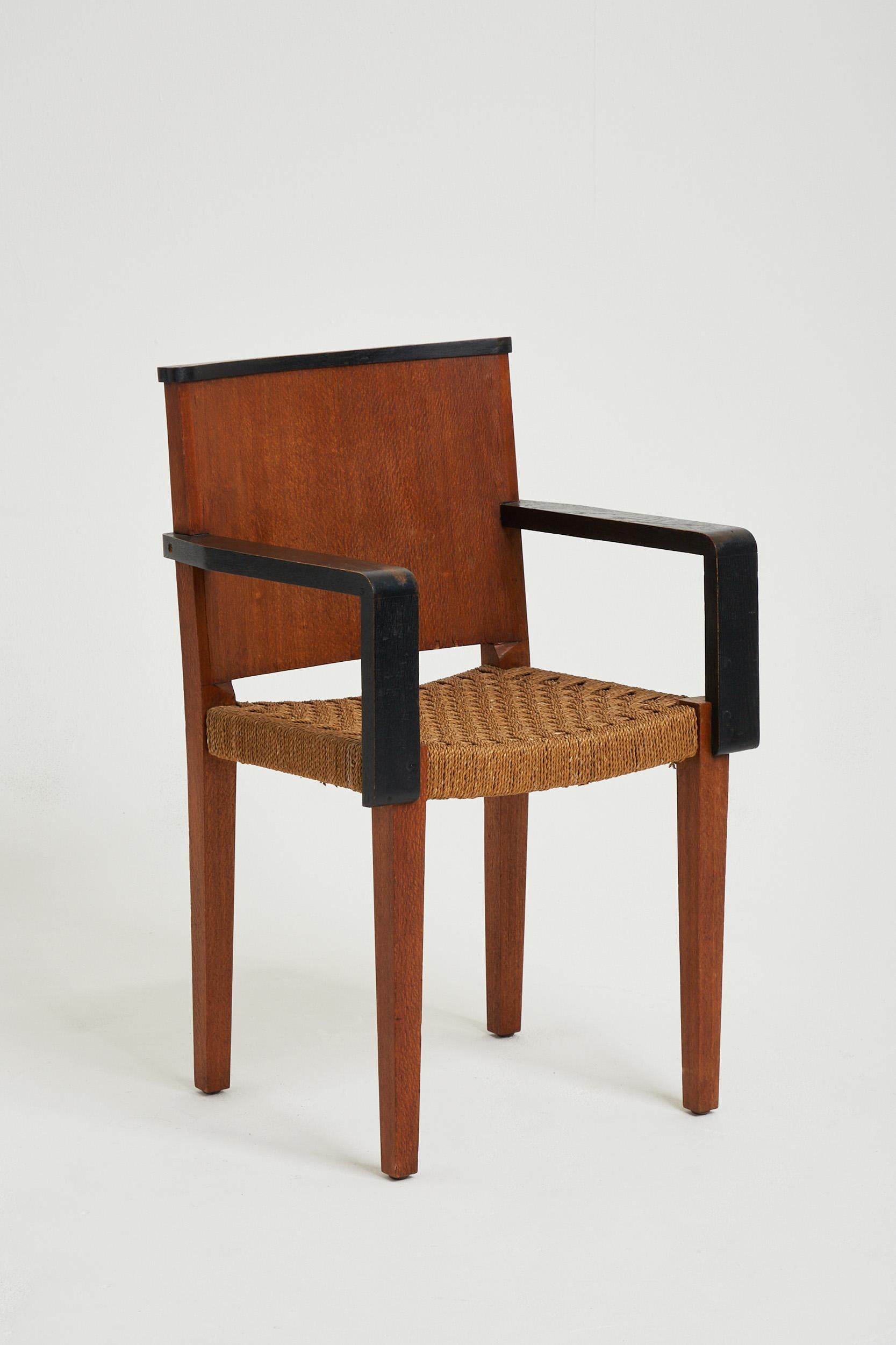 An oak and rope seat armchair
France, Circa 1950.
