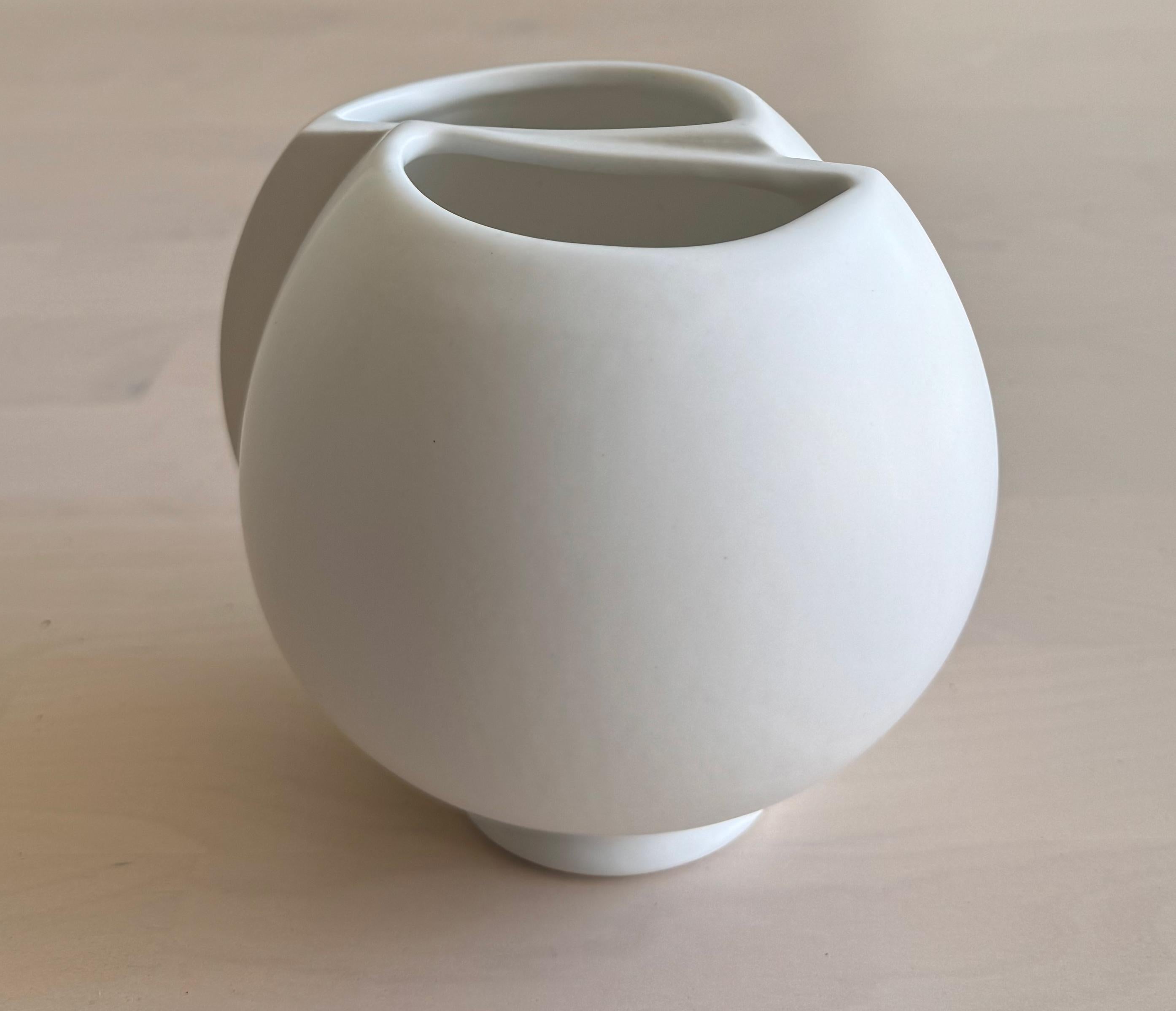 Mid-Centry Modern Wilhelm Kåge Surrea vase with off white Carrara glaze in  a plump, skewed form. The “Surrea” stoneware series was first introduced in 1940, inspired by purism and the work of Le Corbusier. It challenged the aesthetic ideals of the