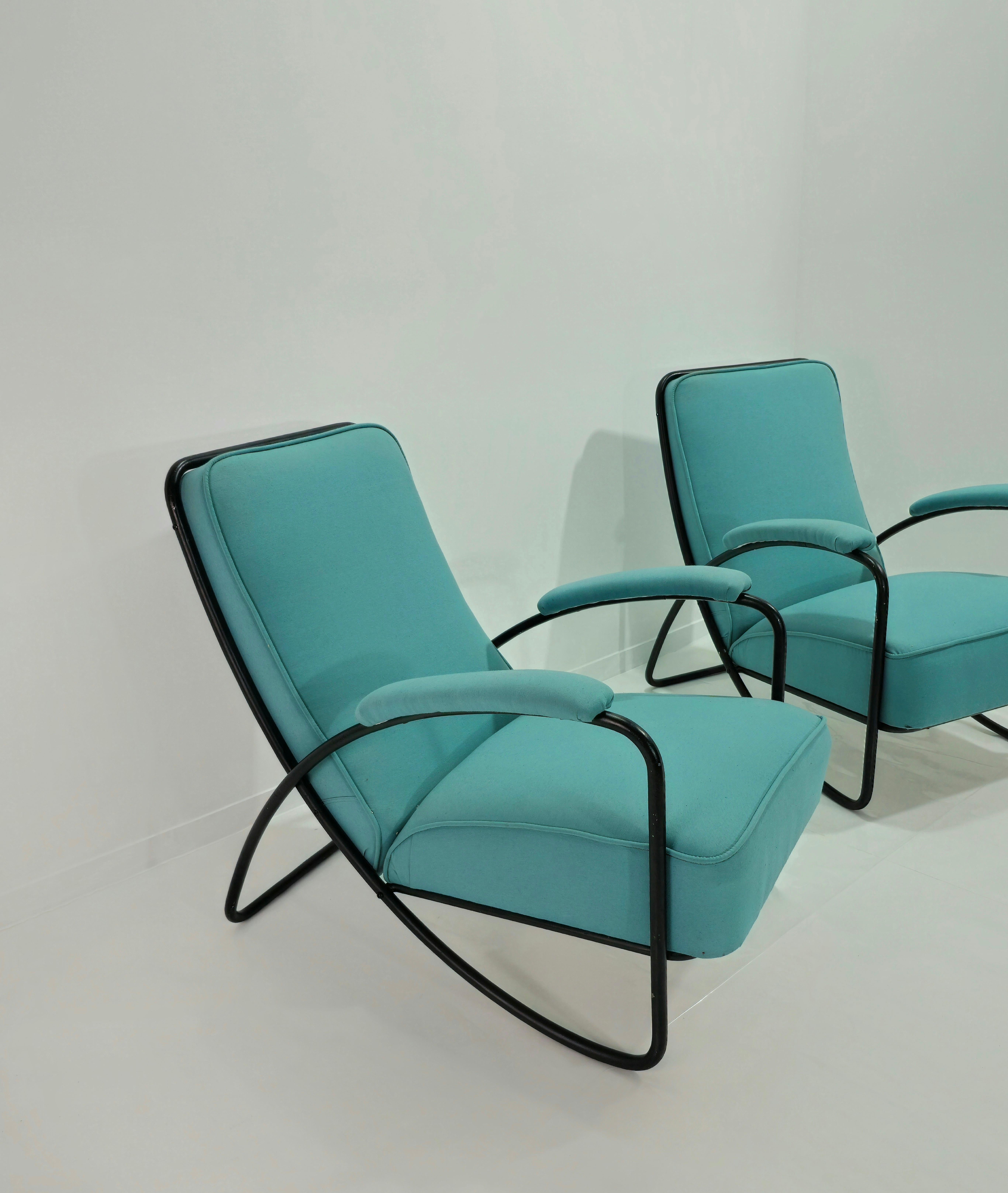 Pair of armchairs with black painted metal tubular structure, backrest and seat with padding and fabric covering in turquoise tones. Please watch the video and photos carefully, thank you.

Weight: 59 Kg

NOTE: We offer our customers an excellent