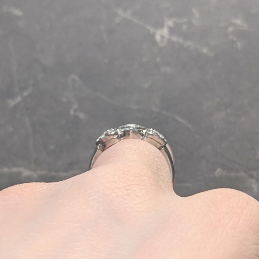Mid-Century 0.32 CTW Diamond Platinum Heart Three Stone Vintage Band Ring For Sale 5