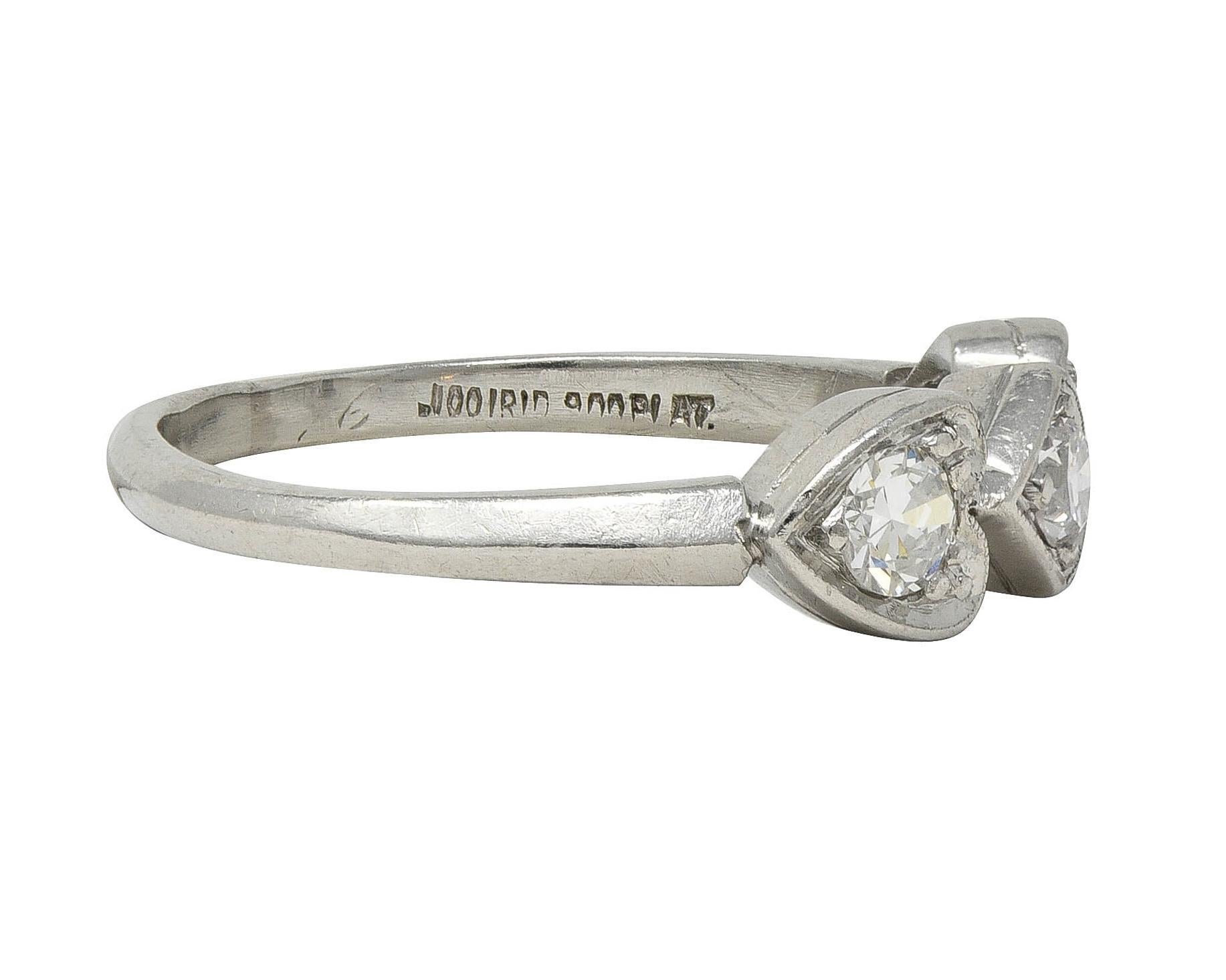 Round Cut Mid-Century 0.32 CTW Diamond Platinum Heart Three Stone Vintage Band Ring For Sale
