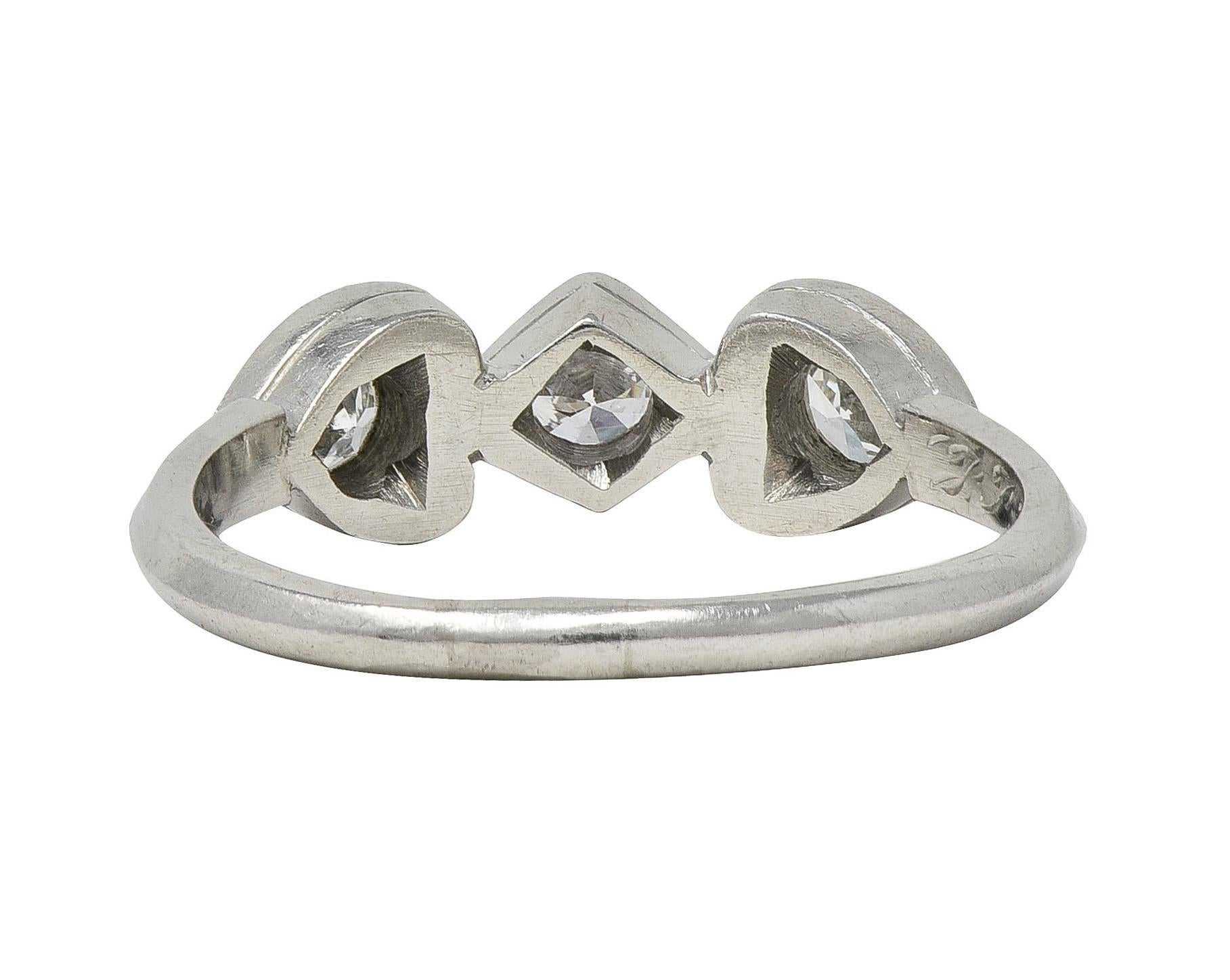 Mid-Century 0.32 CTW Diamond Platinum Heart Three Stone Vintage Band Ring In Excellent Condition For Sale In Philadelphia, PA