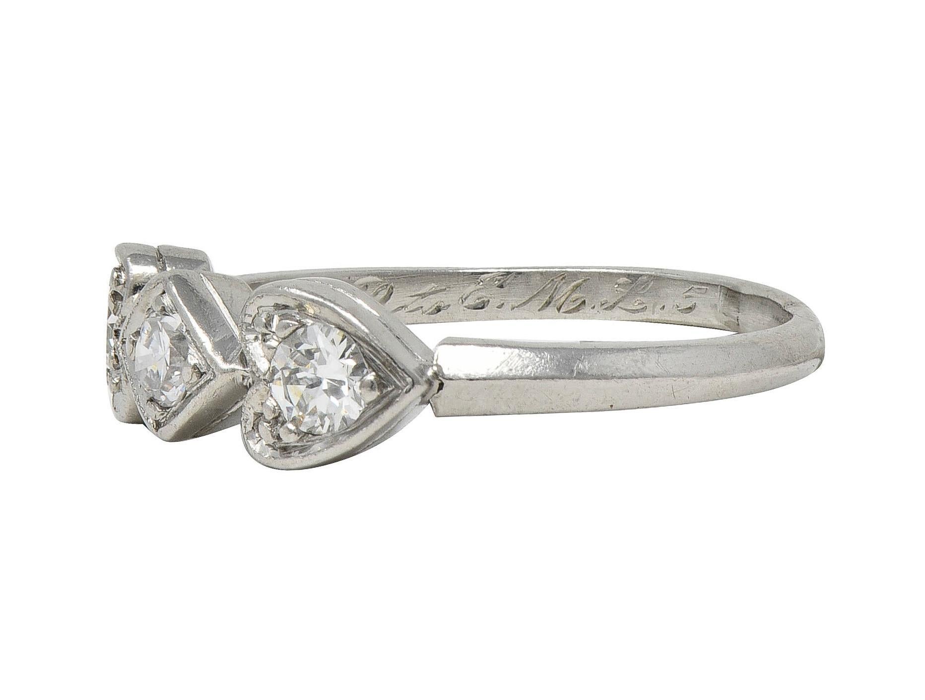 Mid-Century 0.32 CTW Diamond Platinum Heart Three Stone Vintage Band Ring For Sale 1