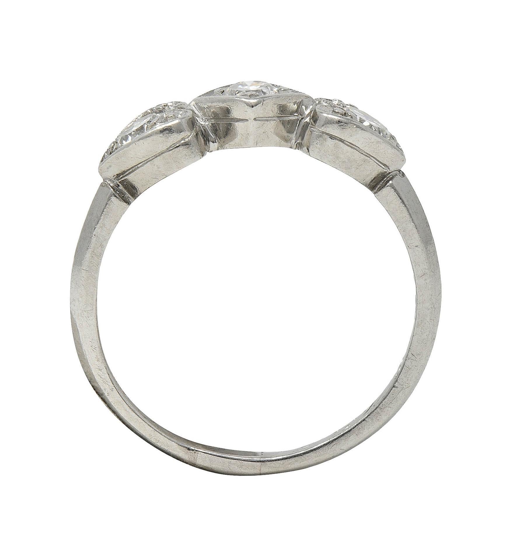 Mid-Century 0.32 CTW Diamond Platinum Heart Three Stone Vintage Band Ring For Sale 3