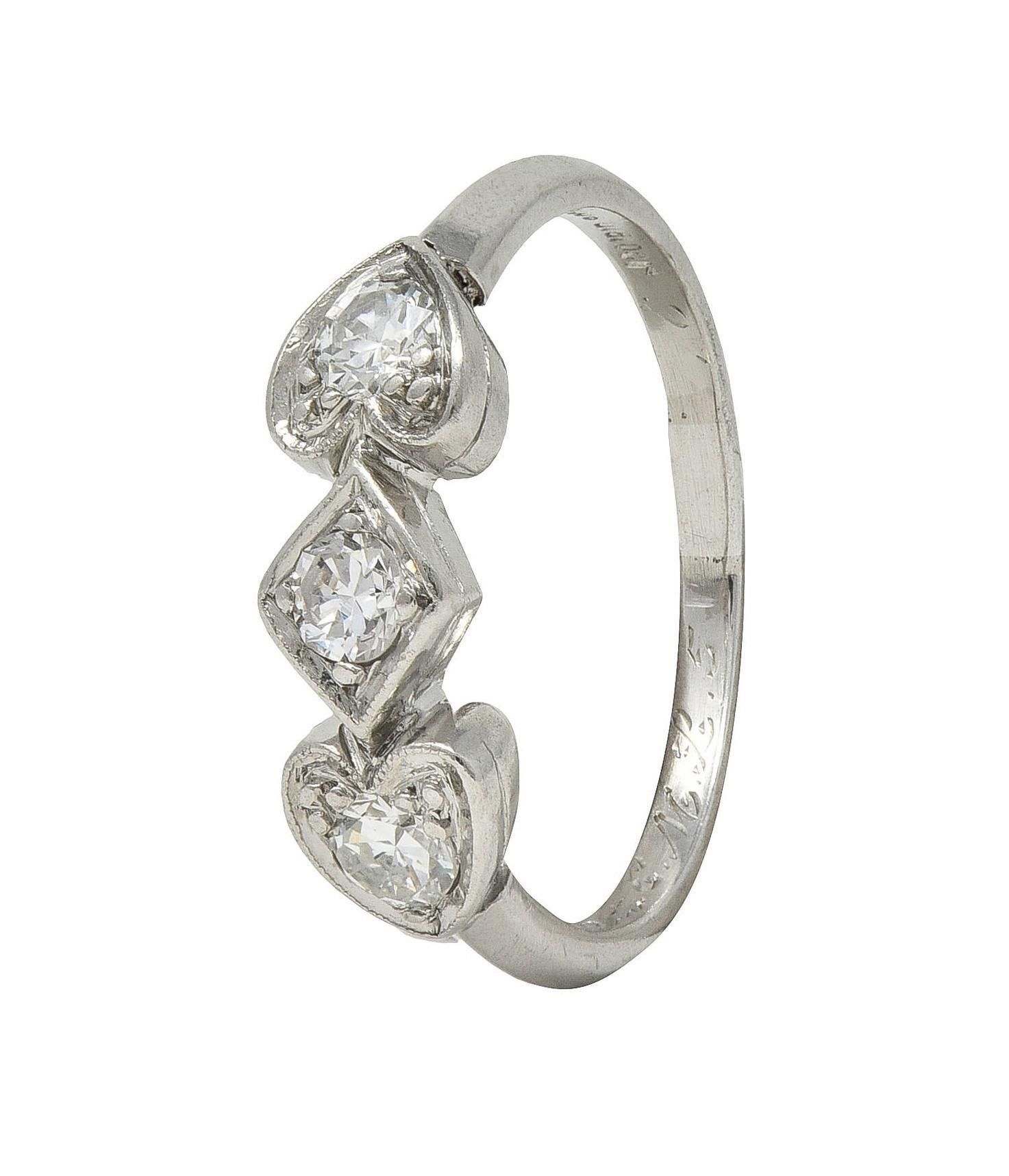Mid-Century 0.32 CTW Diamond Platinum Heart Three Stone Vintage Band Ring For Sale 4