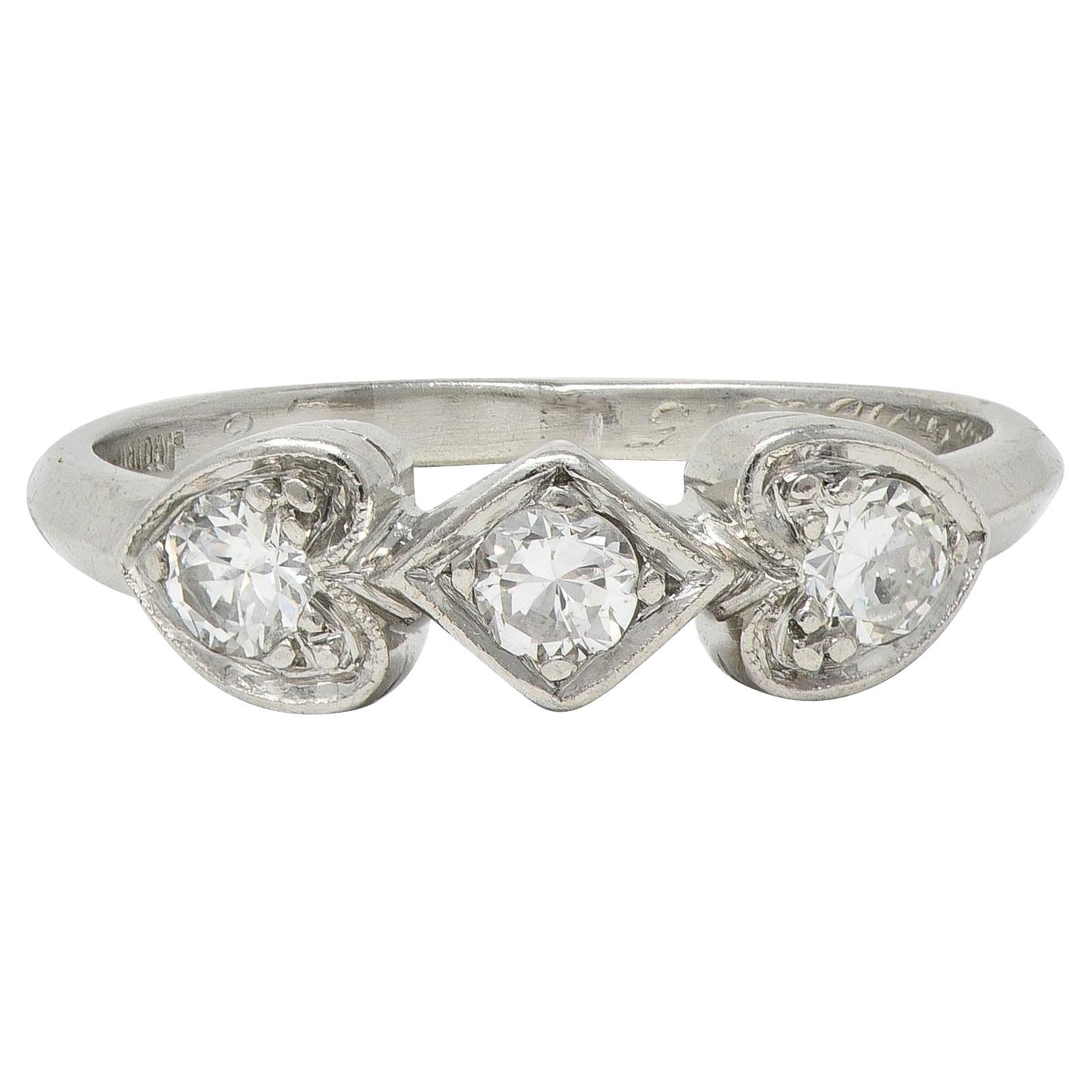 Mid-Century 0.32 CTW Diamond Platinum Heart Three Stone Vintage Band Ring
