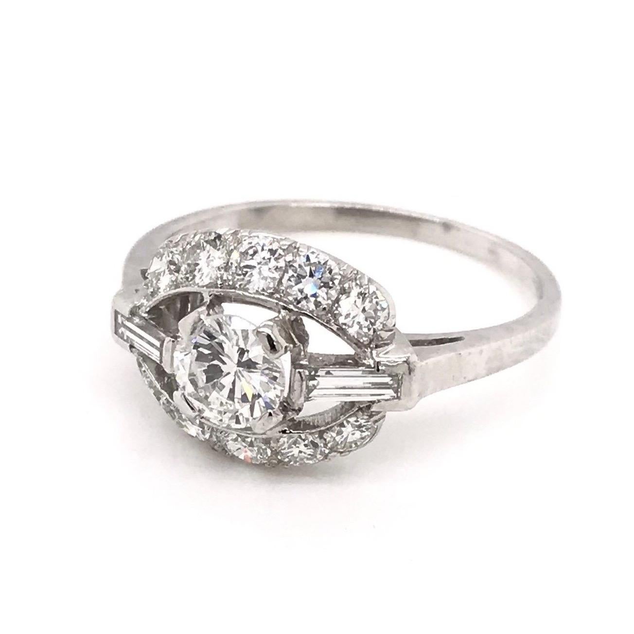 This vintage piece was crafted sometime during the Mid Century design period ( 1940-1960 ). This sweet and simple setting features a 0.40 carat diamond in the center. The center diamond grades approximately I in color, VS2 in clarity. The setting is