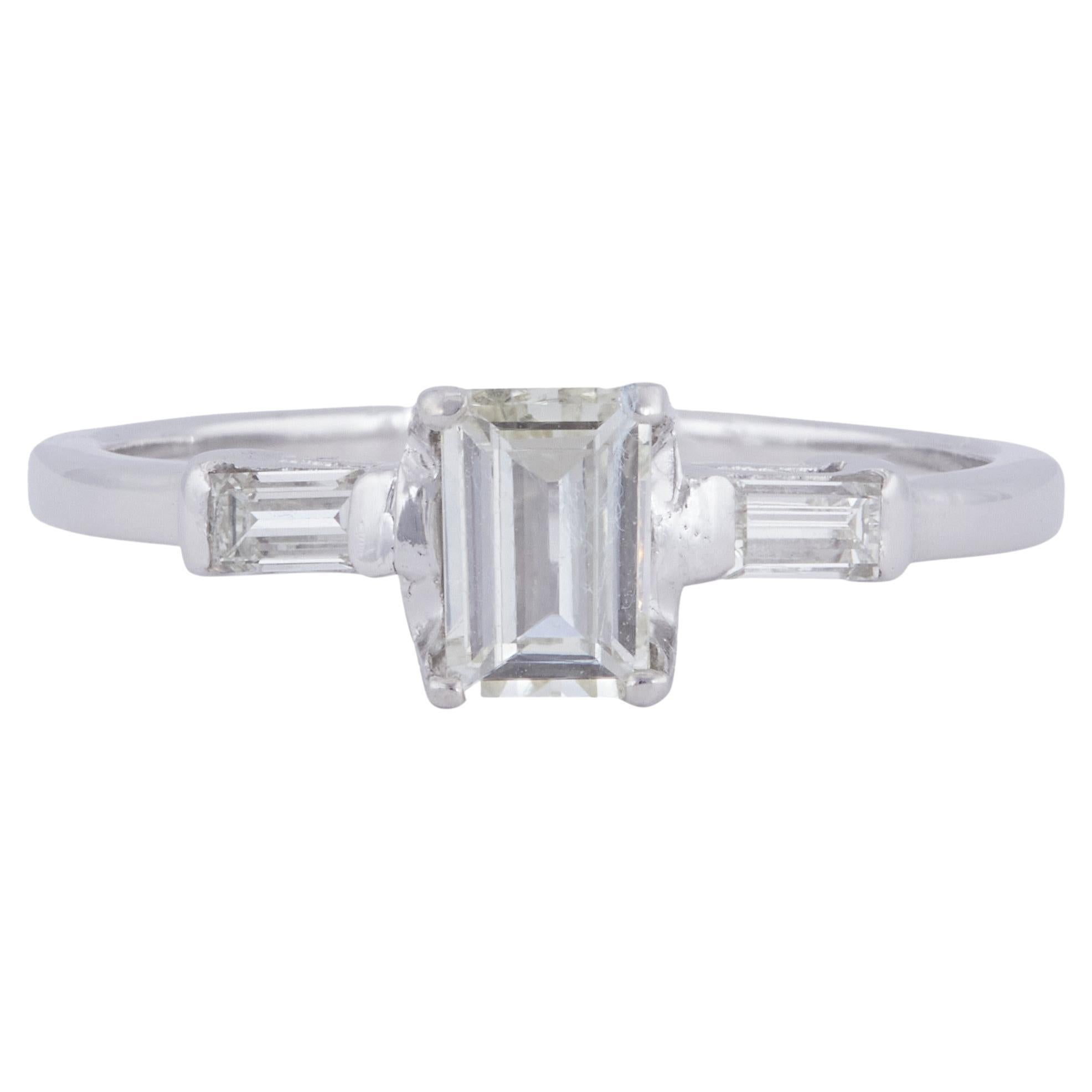 Mid-Century 0.47 Carat Emerald Cut Diamond Platinum Ring For Sale